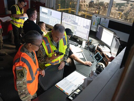 Joint Task Force-Red Hill (JTF-RH) Deputy Commander, U.S. Army Brig. Gen. Michelle Link and JTF-RH Operations Director, U.S. Navy Capt. Shawn Triggs coordinate the commencement of gravity defueling Oct. 16, 2023, at Joint Base Pearl Harbor-Hickam, Hawaii.