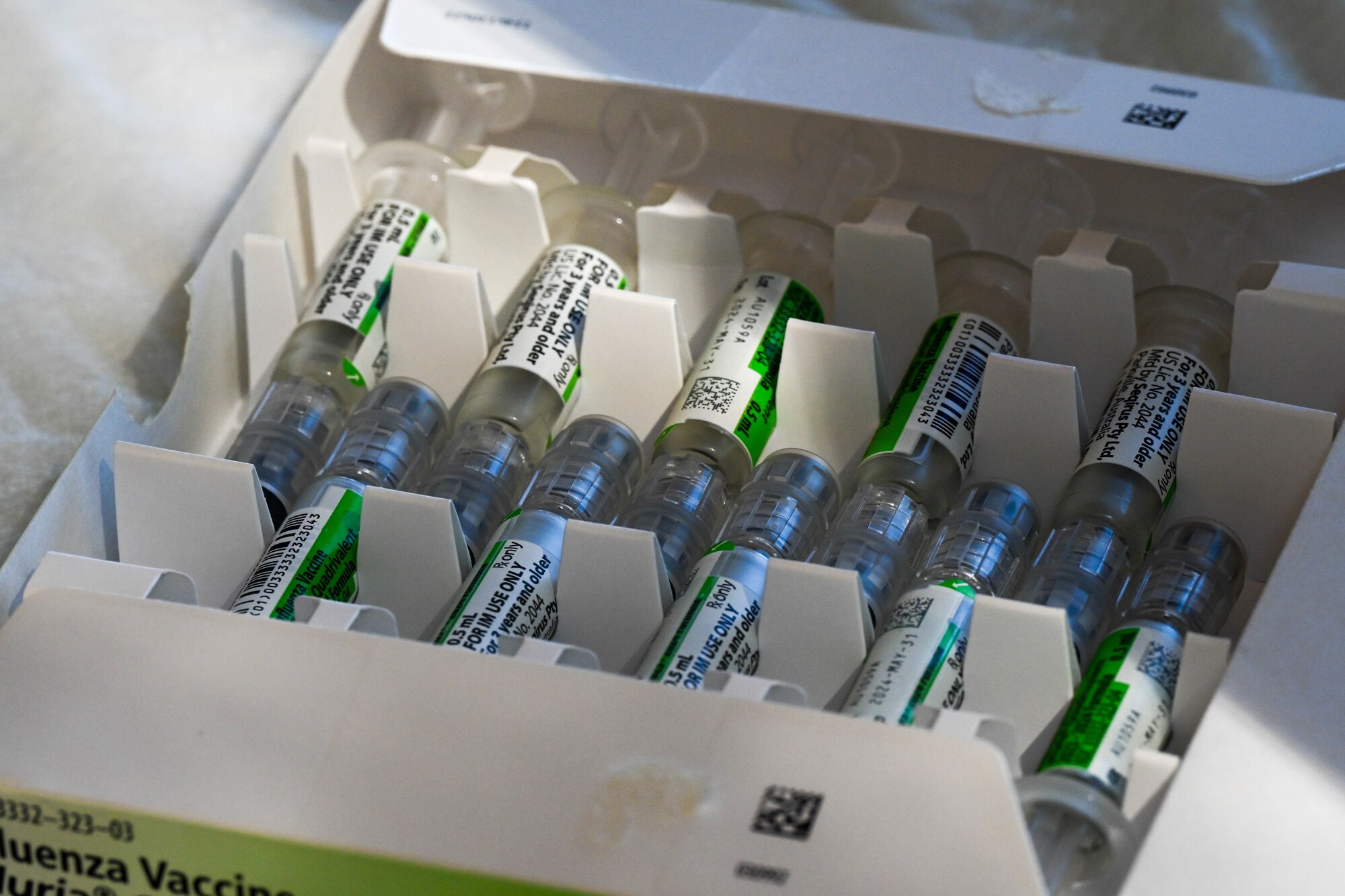 The 15th Medical Group prepares influenza vaccinations for a flu vaccination clinic at Joint Base Pearl Harbor-Hickam, Hawaii, Oct. 18, 2023. The 15th Medical Group hosted the flu vaccination clinic for three weeks vaccinating thousands of Airmen and their dependents. (U.S. Air Force photo by Senior Airman Makensie Cooper)