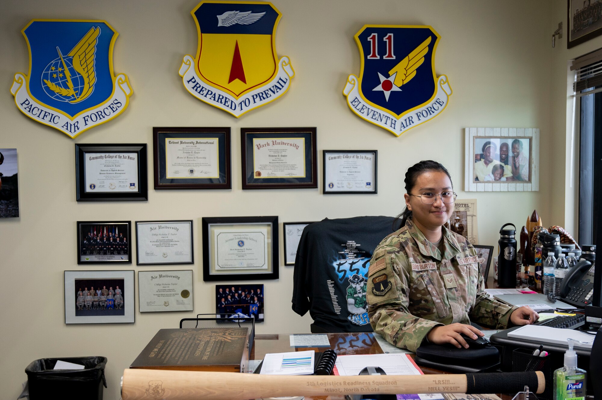 U.S. Air Force Senior Airman Geri Surio Burton, the resource advisor assigned to the 36th Operations Group, sits at the 36th Wing command chief’s desk at Andersen Air Force Base, Guam, Oct. 18, 2023. Surio Burton participated in the 36th Wing’s command chief for a day program to gain insight on what it is like to be a leader at the wing level.  (U.S. Air Force photo by Senior Airman Emily Saxton)