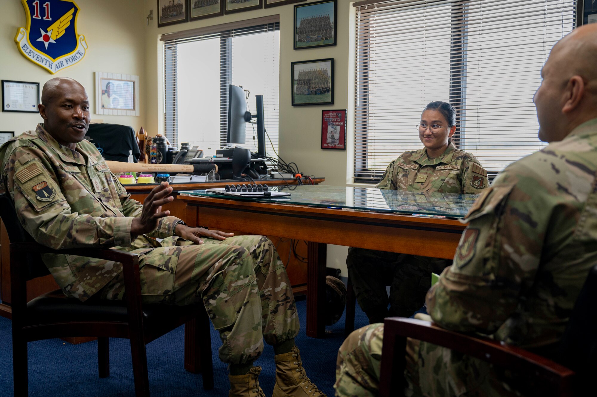 U.S. Air Force Senior Airman Geri Surio Burton, the resource advisor assigned to the 36th Operations Group, and U.S. Air Force Chief Master Sgt. Nicholas Taylor, the 36th Wing command chief, meet with U.S. Air Force Chief Master Sgt. Pedro Jimenez, the chief enlisted manager of public affairs assigned to Pacific Air Forces’, at Andersen Air Force Base, Guam, Oct. 18, 2023. Surio Burton participated in the 36th Wing’s command chief for a day program to gain insight on what it is like to be a leader at the wing level.  (U.S. Air Force photo by Senior Airman Emily Saxton)