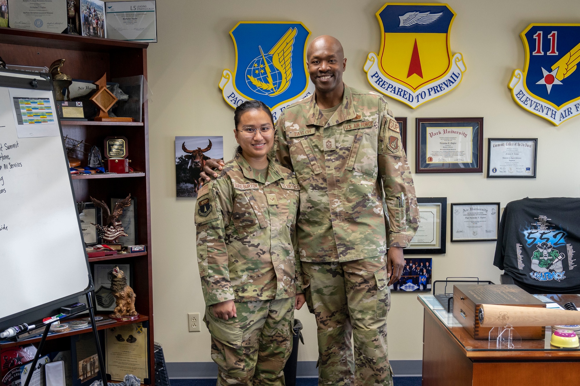 U.S. Air Force Senior Airman Geri Surio Burton, the resource advisor assigned to the 36th Operations Group, and U.S. Air Force Chief Master Sgt. Nicholas Taylor, the 36th Wing command chief, pose for a photo at Andersen Air Force Base, Guam, Oct. 18, 2023. Surio Burton participated in the 36th Wing’s command chief for a day program to gain insight on what it is like to be a leader at the wing level. (U.S. Air Force photo by Senior Airman Emily Saxton)