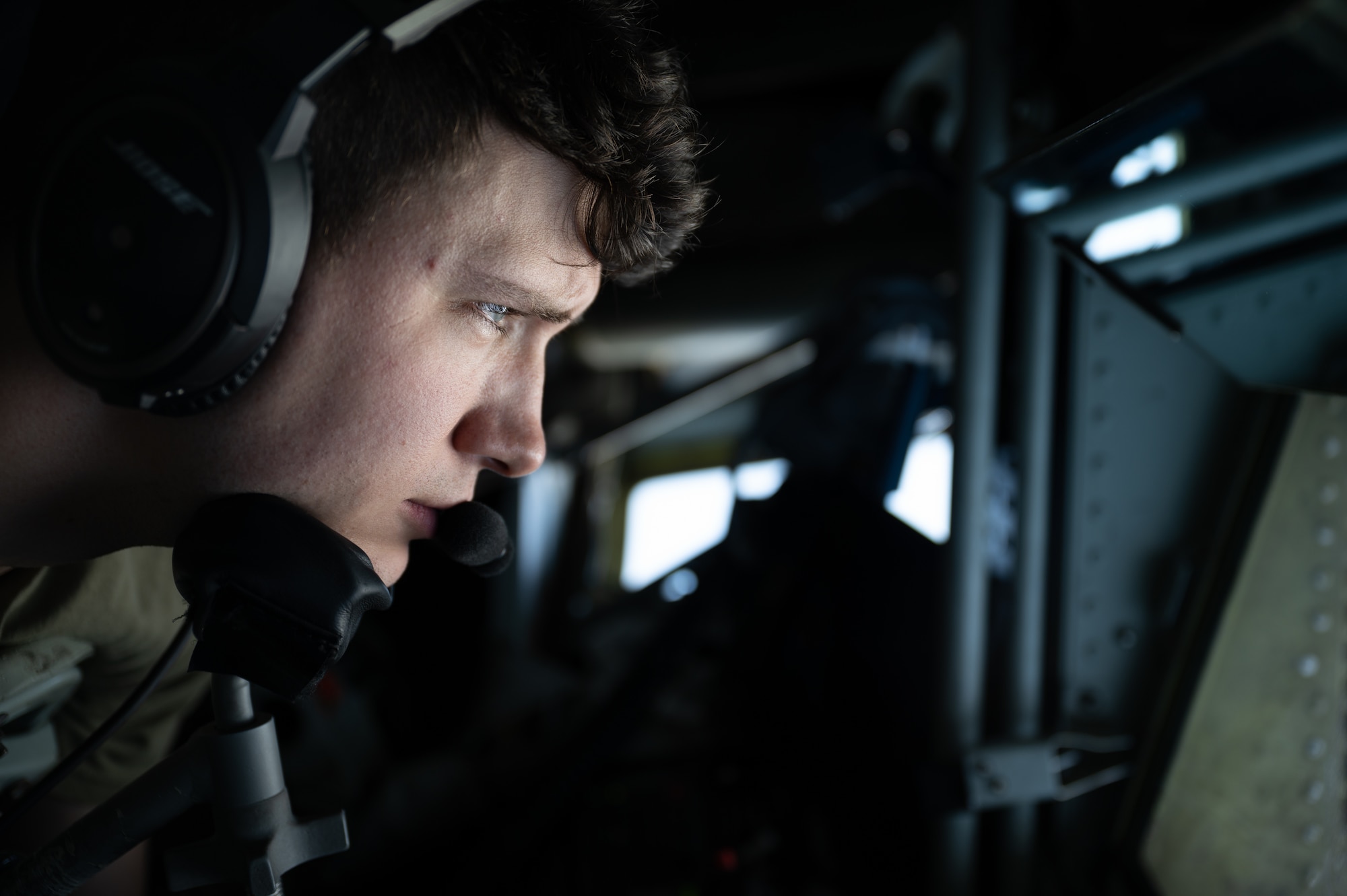 An Airman controls aerial refueling.