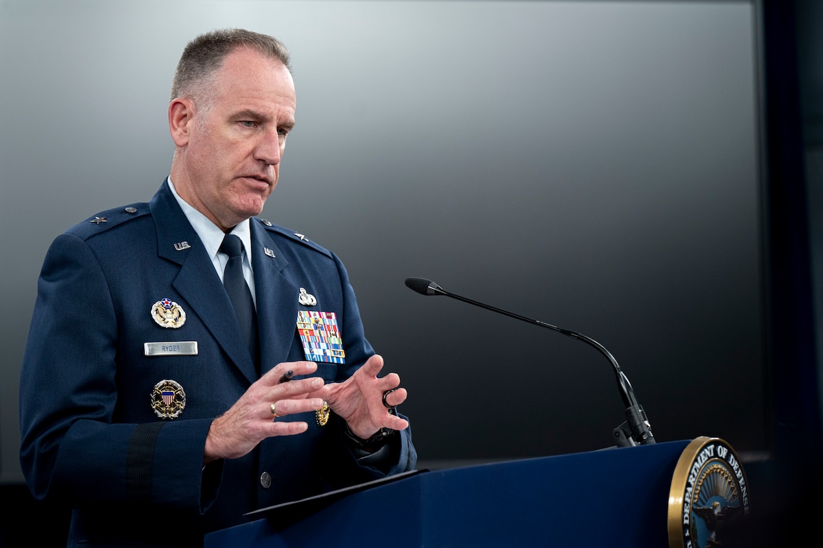 A man speaks from a podium.