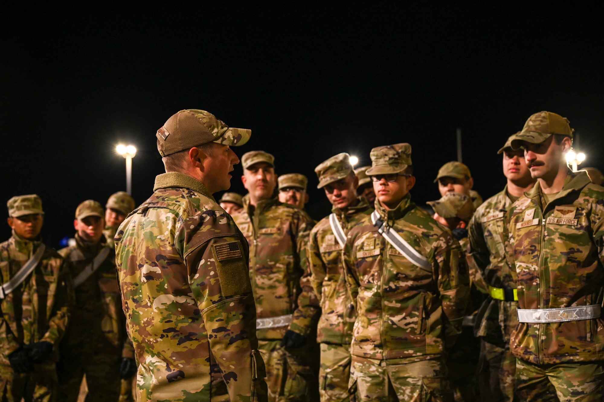 U.S. Air Force Lt. Col. Ben Davidson, 97th Training Squadron (TRS) commander, gives a speech to TRS students before they begin the first portion of the Talon Challenge at Altus Air Force Base, Oklahoma, Oct. 14, 2023. Their day began with a march from the running track to the training area, one and a half miles away. (U.S. Air Force photo by Airman 1st Class Kari Degraffenreed)