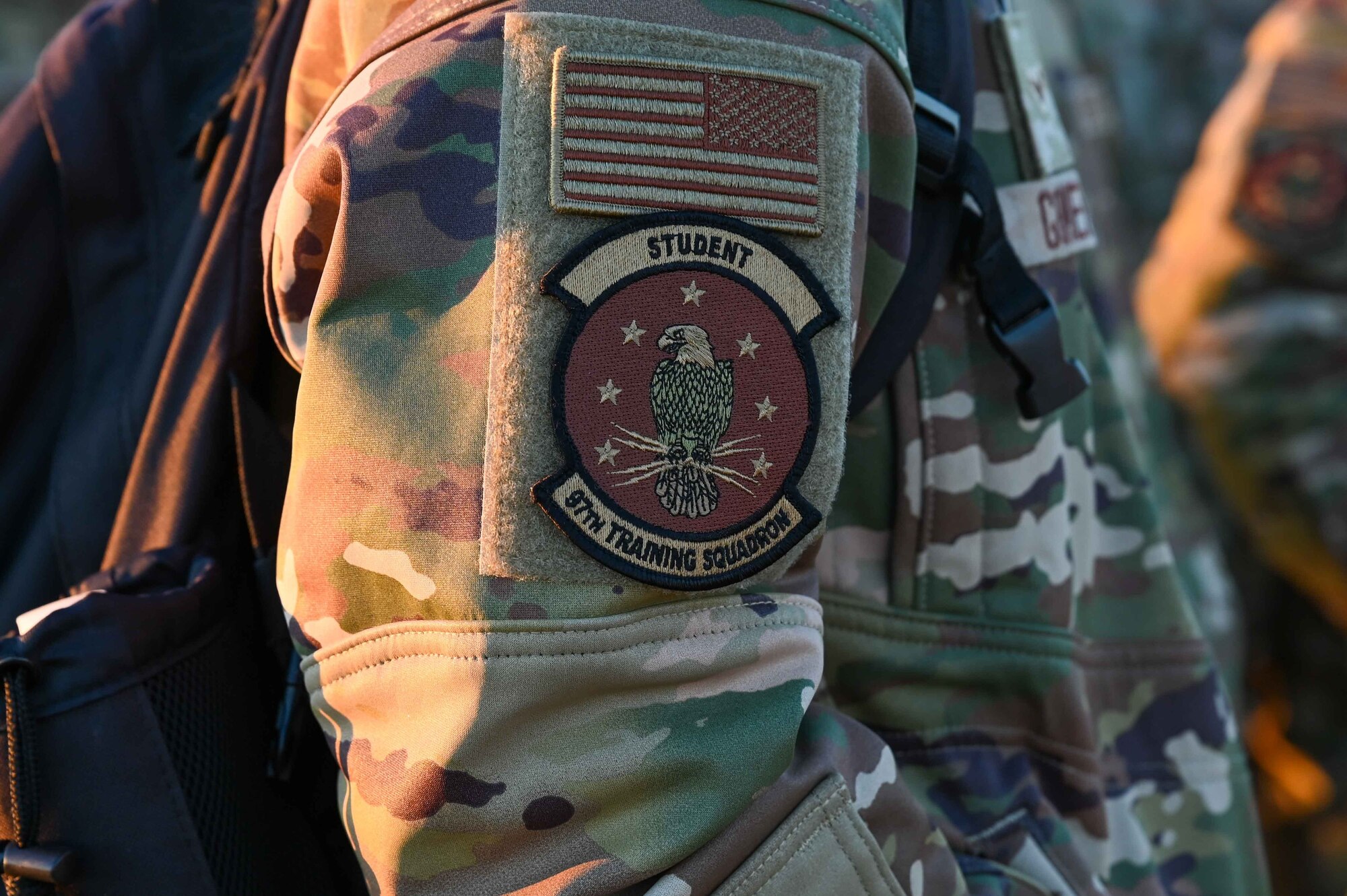 U.S. Air Force Airman 1st Class Qyarrius Gates, 97th Training Squadron (TRS) boom operator student, wears a 97th TRS student patch during the Talon Challenge at Altus Air Force Base, Oklahoma, Oct. 14, 2023. The Talon Challenge is an event put on by the 97th TRS leaders to grow students, mentor them, and take them back to the basics of being an Airman. (U.S. Air Force photo by Airman 1st Class Kari Degraffenreed)
