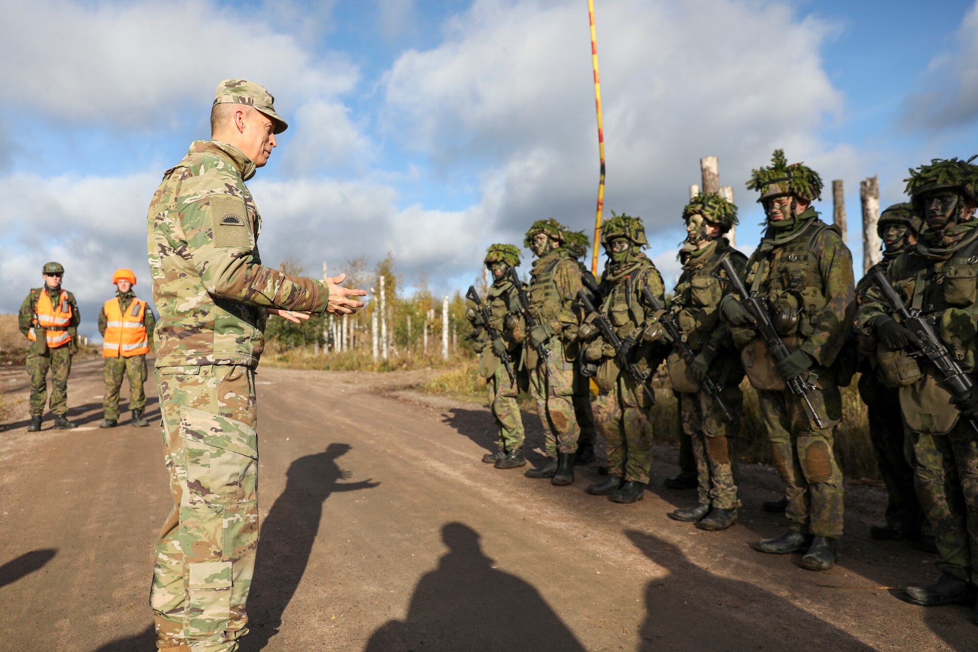 Army Gen. Daniel Hokanson, chief, National Guard Bureau, talks with Finnish troops in Vekaranjarvi, Finland, Oct. 13, 2023. Hokanson visited Finland to enhance bilateral ties between and the National Guard and Finland.