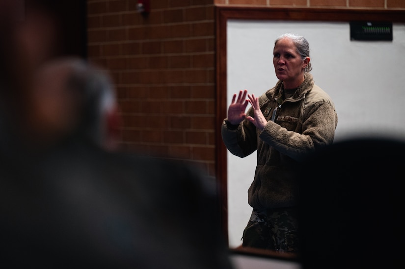 U.S. Air Force Col. Elizabeth Hanson, 305th Air Mobility Wing Commander, presents closing remarks during the bi-annual KC-46A Pegasus Weapons System Council meeting hosted at Joint Base McGuire-Dix-Lakehurst, N.J., Oct. 17, 2023. The WSC’s goal is to synchronize cooperation, and foster communication and collaboration across 10 KC-46 wings and Air Mobility Command to increase warfighting capabilities. (U.S. Air Force photo by Senior Airman Sergio Avalos) (This photo has been altered for security purposes)