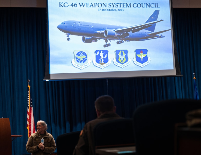U.S. Air Force Col. Elizabeth Hanson, 305th Air Mobility Wing Commander, presents closing remarks during the bi-annual KC-46A Pegasus Weapons System Council meeting hosted at Joint Base McGuire-Dix-Lakehurst, N.J., Oct. 17, 2023. The WSC’s goal is to synchronize cooperation, and foster communication and collaboration across 10 KC-46 wings and Air Mobility Command to increase warfighting capabilities. (U.S. Air Force photo by Senior Airman Sergio Avalos) (This photo has been altered for security purposes)