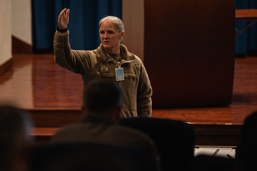 U.S. Air Force Col. Elizabeth Hanson, 305th Air Mobility Wing Commander, presents closing remarks during the bi-annual KC-46A Pegasus Weapons System Council meeting hosted at Joint Base McGuire-Dix-Lakehurst, N.J., Oct. 17, 2023. The WSC’s goal is to synchronize cooperation, and foster communication and collaboration across 10 KC-46 wings and Air Mobility Command to increase warfighting capabilities. (U.S. Air Force photo by Senior Airman Sergio Avalos) (This photo has been altered for security purposes)