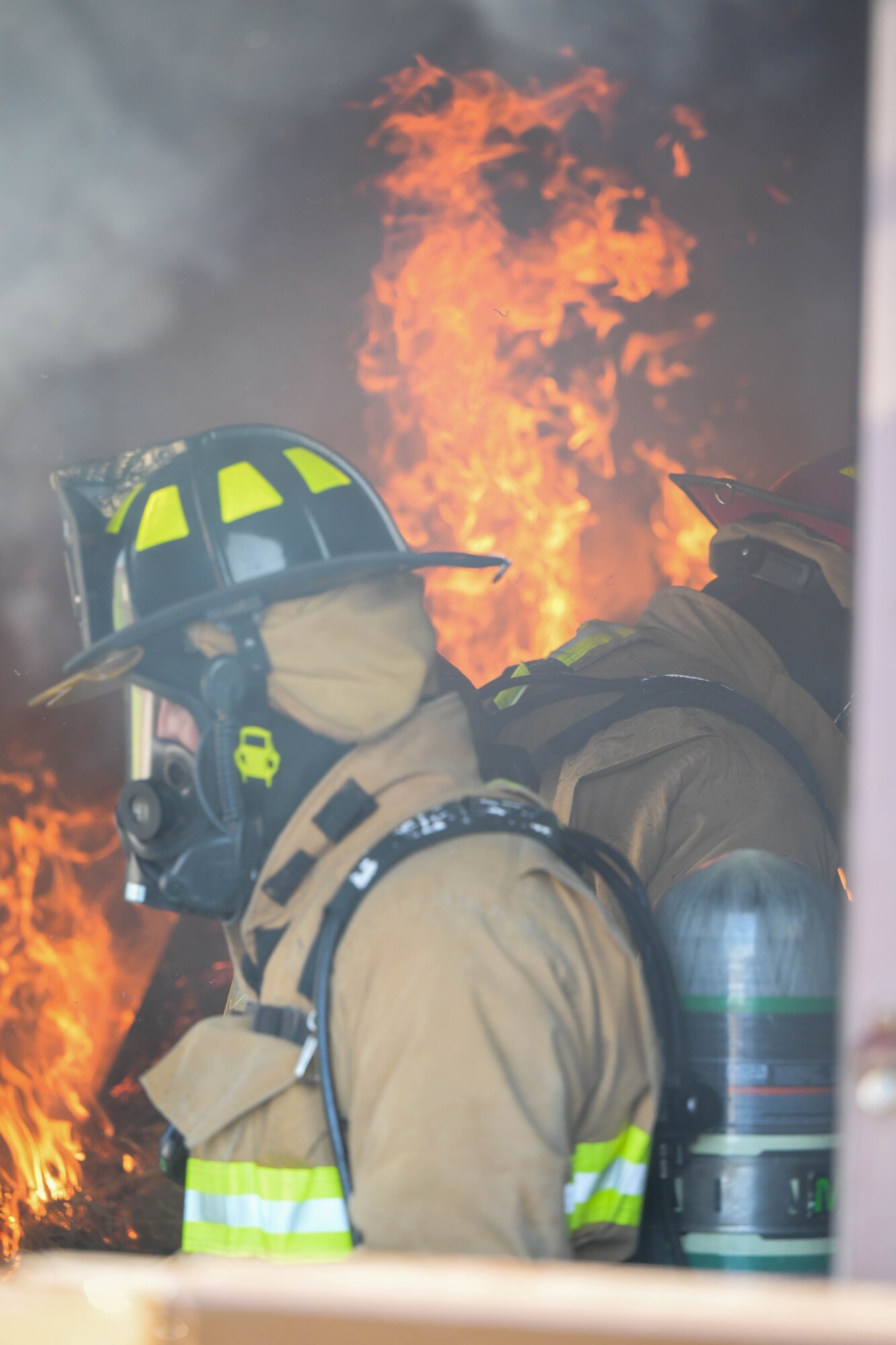 Liberty Township firefighters respond to a structural fire during a training event at Youngstown Air Reserve Station, Ohio, utilizing the base fire department's structural fire training building on Oct. 3, 2023.