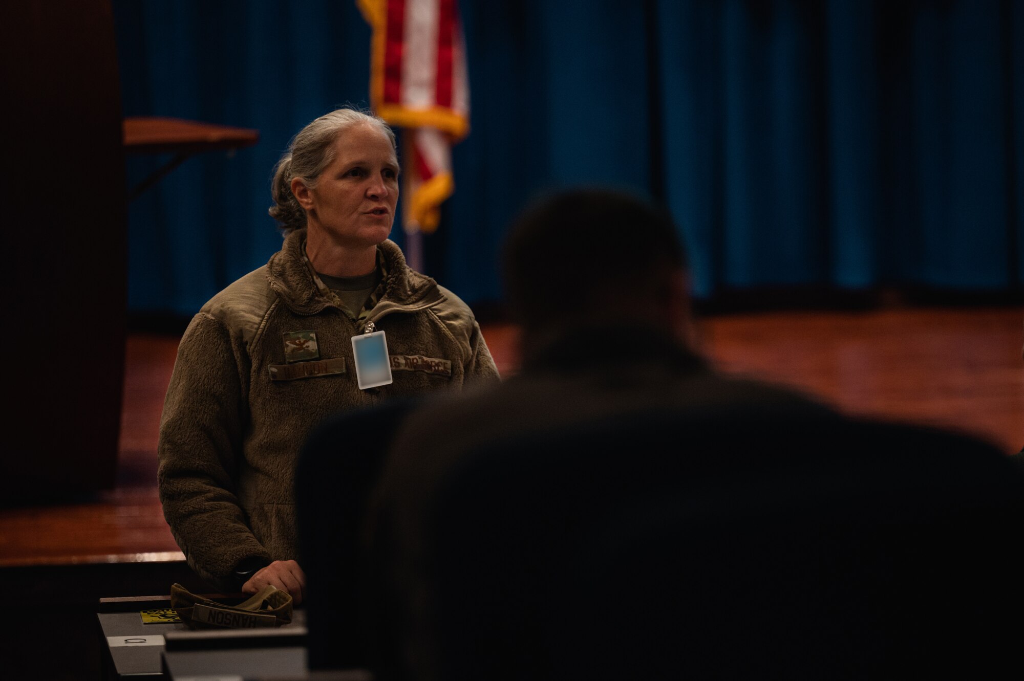 U.S. Air Force Col. Elizabeth Hanson, 305th Air Mobility Wing Commander, presents closing remarks during the bi-annual KC-46A Pegasus Weapons System Council meeting hosted at Joint Base McGuire-Dix-Lakehurst, N.J., Oct. 17, 2023. The WSC’s goal is to synchronize cooperation, and foster communication and collaboration across 10 KC-46 wings and Air Mobility Command to increase warfighting capabilities. (U.S. Air Force photo by Senior Airman Sergio Avalos) (This photo has been altered for security purposes)