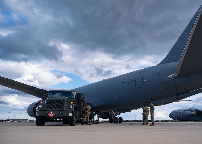 U.S. Air Force Airmen assigned to the 87th Logistics Readiness Squadron and the 305th Air Mobility Wing conduct a hot pit refueling at Joint Base McGuire-Dix-Lakehurst, N.J., Oct. 17, 2023. This event marked the first time the 305th AMW Airmen executed the Special Fuels Operation, which is instrumental to Agile Combat Employment objectives and increases operational capabilities. (U.S. Air Force photo by Staff Sgt. Monica Roybal)
