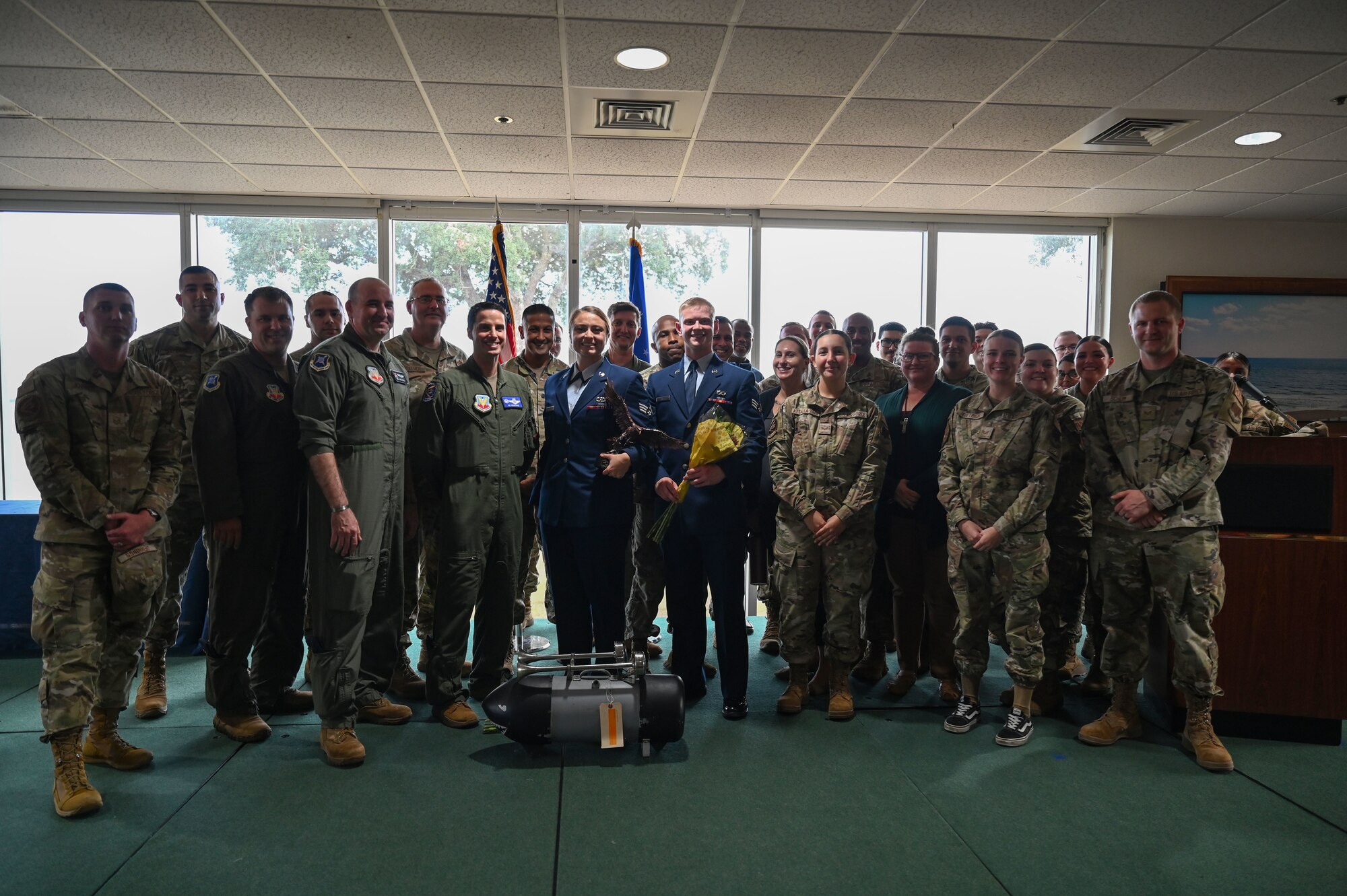 Members from the 350th Spectrum Warfare Wing pose for a group photo with two members graduating from Airman Leadership School (ALS) class 23-G, at Eglin Air Force Base, Fla., Oct. 19, 2023. Airman Leadership School hones leadership skills senior airmen need in order to grow as the next generation of supervisors and reporting advisers. (U.S. Air Force photo by Staff Sgt. Ericka A. Woolever)