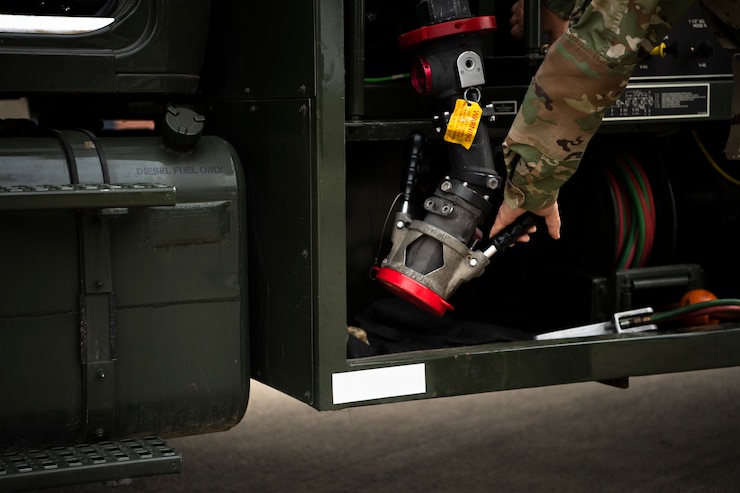 Staff Sgt. Austin Coe, fuel specialist assigned to the 110th Logistics Readiness Squadrons, fuels a UH-60 Blackhawk, assigned to the 147th Aviation Regiment, Grand Ledge Armory, at the Battle Creek Air National Guard Base(BCANGB), Battle Creek, Mich., May 6, 2023. Seven Army UH-60 Blackhawks transported Marines, assigned to the 1st Battalion, 24th Marines Regiment, from BCANGB to Camp Grayling, as a part of a joint platoon live-fire exercise.