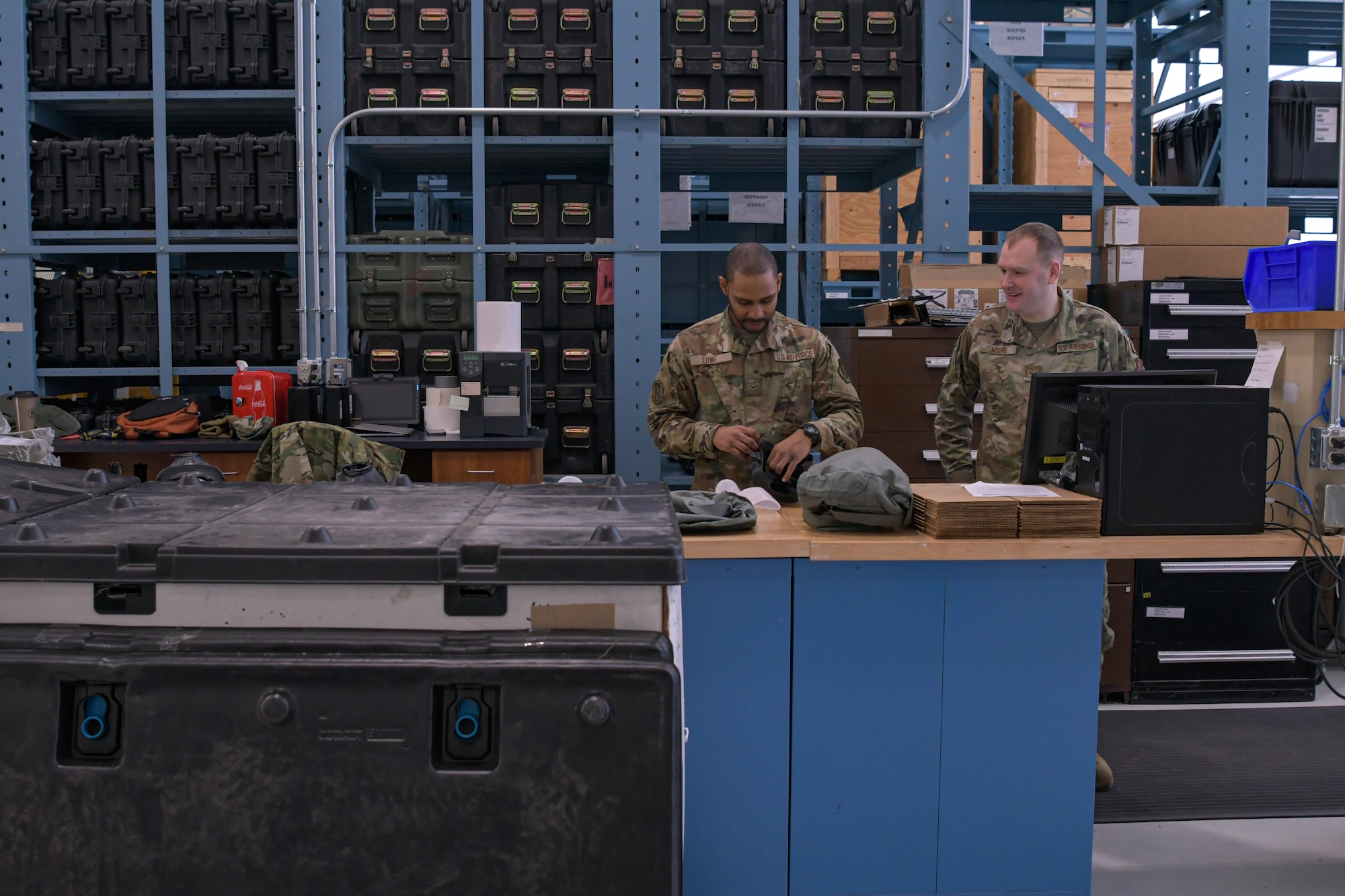 Airman 1st Class Able Lowe, Asset Management, left, and Senior Airman Randall Moore, Mobility Technician from the Logistics Readiness Squadron prepare gas masks at Battle Creek Air National Guard Base, Mich., Feb. 5, 2023. They completed gas mask testing by checking for any air leaks.