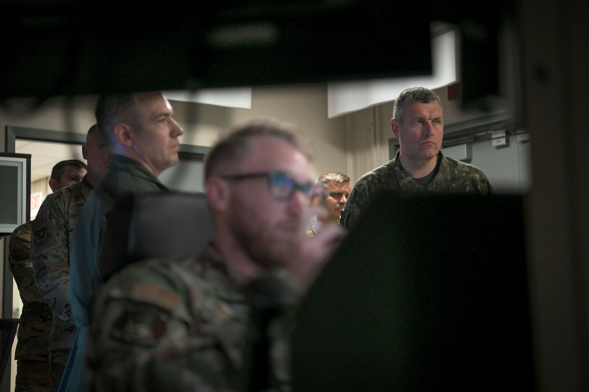 Lt. Gen. Leonīds Kalniņš, Latvia chief of defense, observes the MQ-9 Reaper flight simulator during a visit to the Battle Creek Air National Guard Base, Michigan, Aug 2, 2021. The purpose of the visit was to observe the missions at the base to maximize multi-national training opportunities through the Michigan-Latvian partnership.