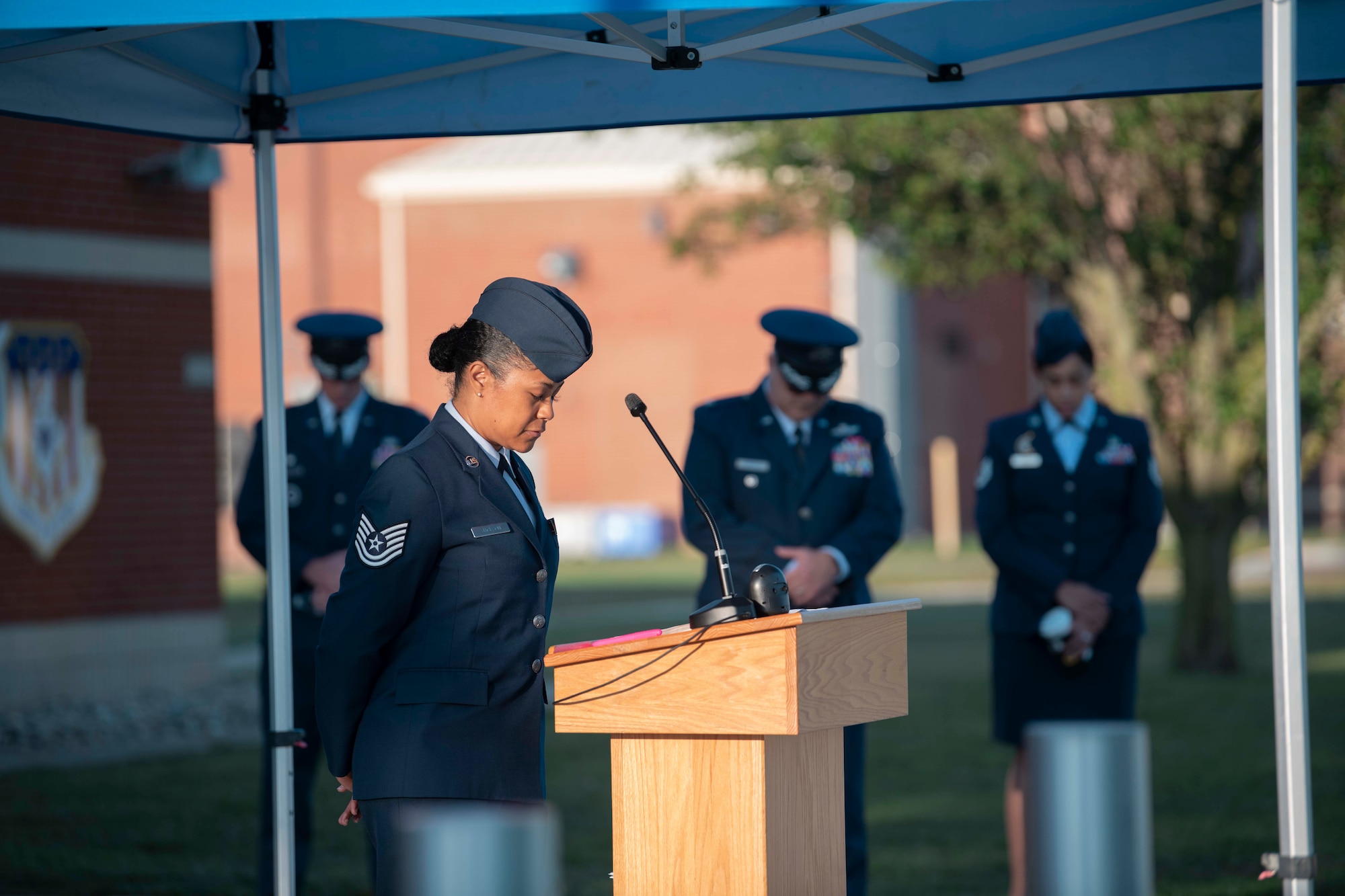Members of the 110th Wing pause for a moment of silence during an inaugural National Prisoner of War and Missing in Action Recognition Day ceremony at the Battle Creek Air National Guard Base, Michigan on Sept 15, 2023. Service members and civilians gathered at the event to honor those who never made it home.