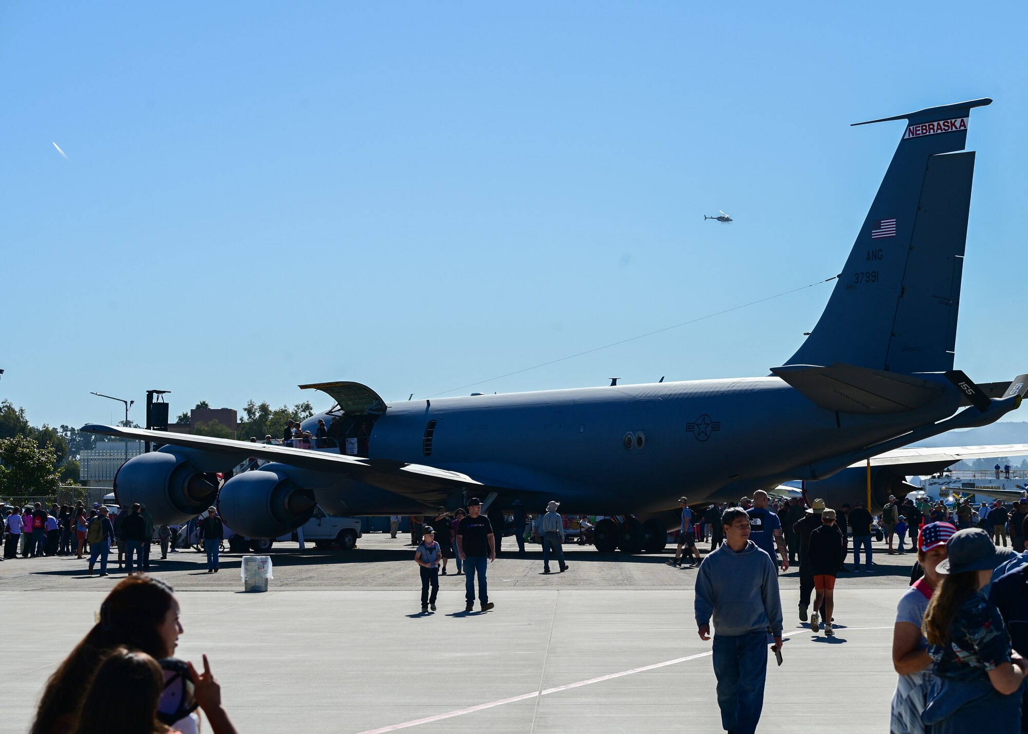 A military aircraft is staged on a runway.