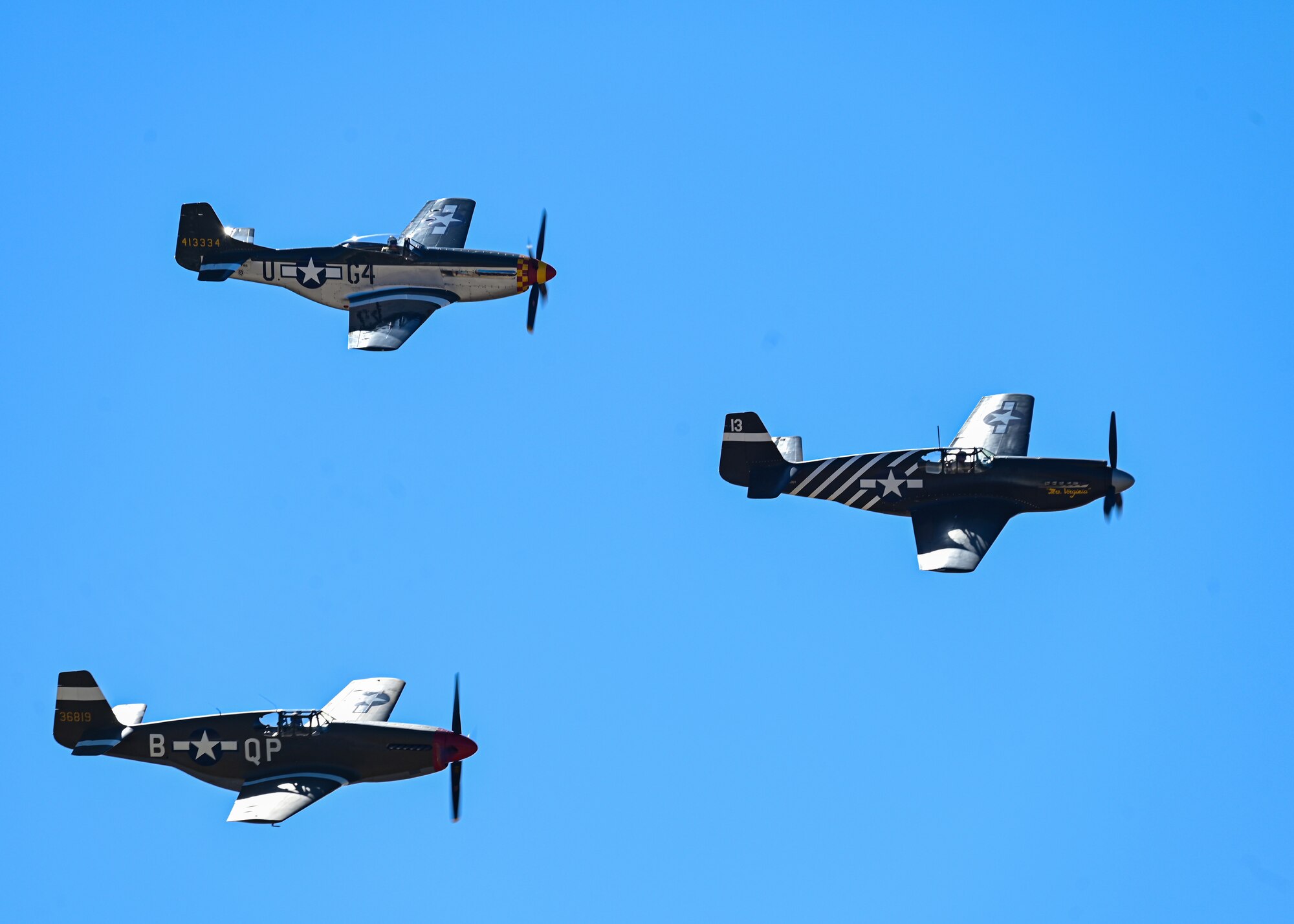 Vintage planes fly in a formation.