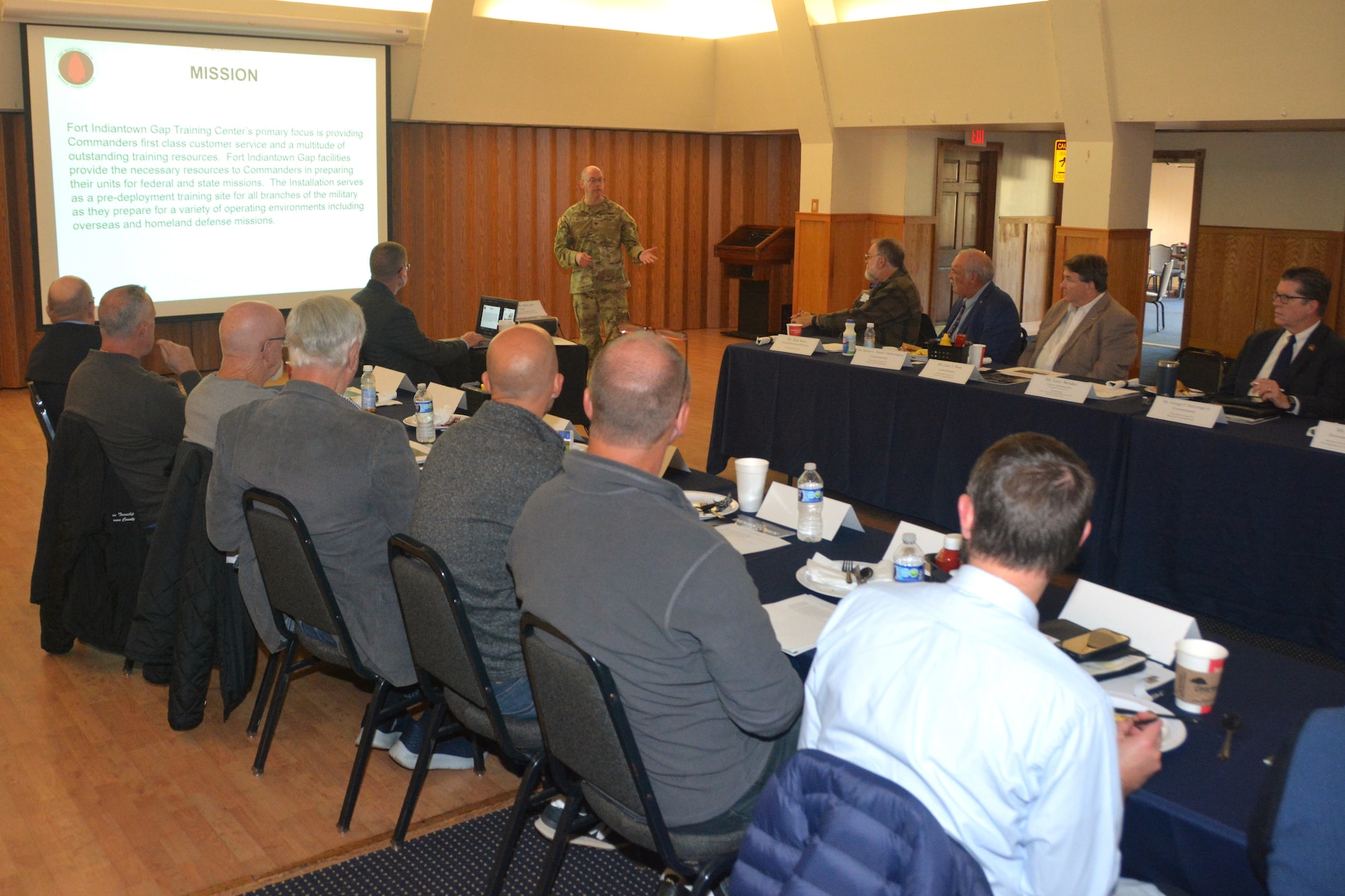 Fort Indiantown Gap garrison commander Col. Kevin Potts, standing, briefs local government officials about the installation's mission and capabilities Oct. 19, 2023, at Fort Indiantown Gap, Pa. (Pennsylvania National Guard photo by Brad Rhen)