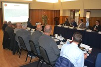Fort Indiantown Gap garrison commander Col. Kevin Potts, standing, briefs local government officials about the installation's mission and capabilities Oct. 19, 2023, at Fort Indiantown Gap, Pa. (Pennsylvania National Guard photo by Brad Rhen)