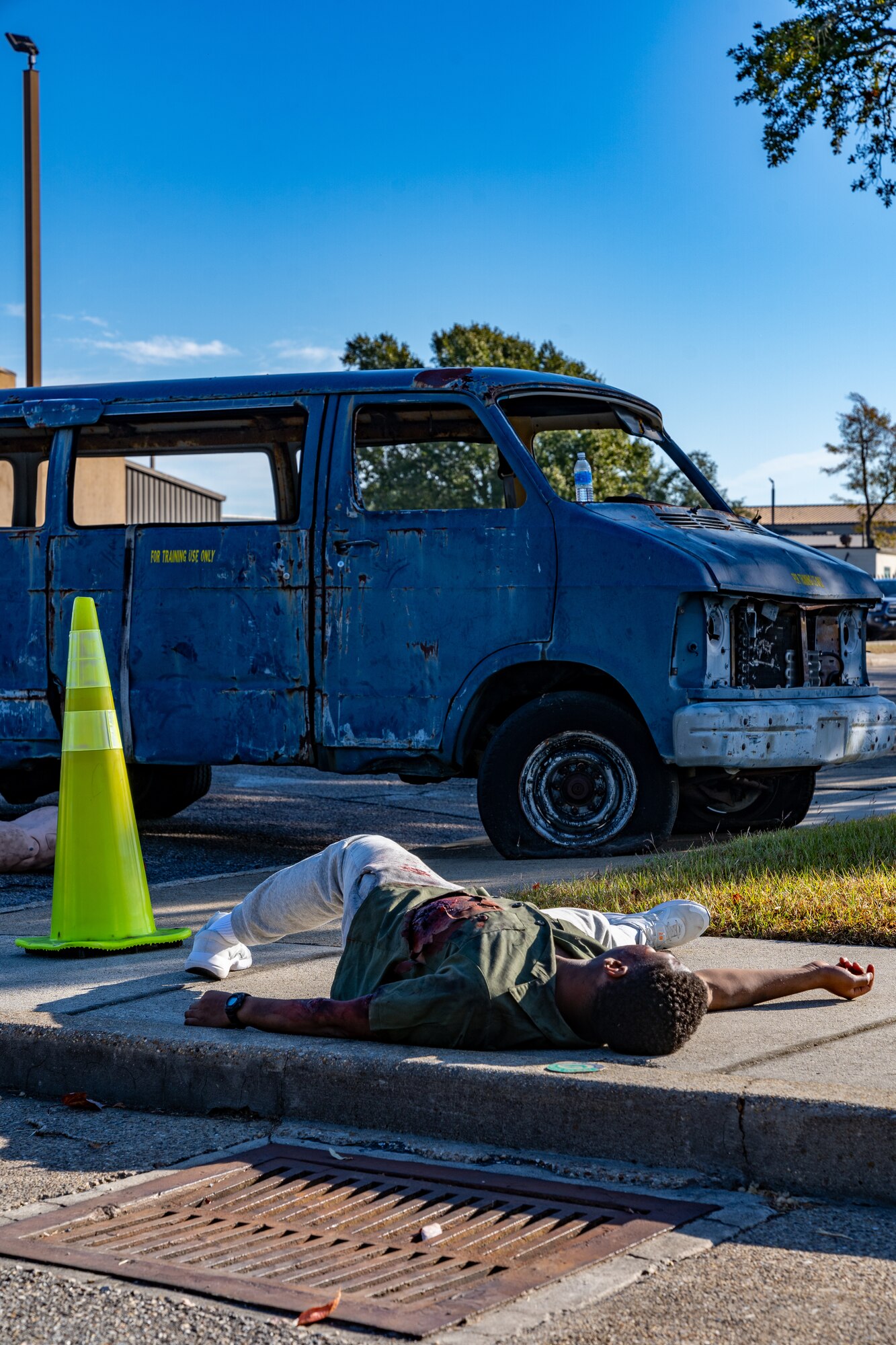 U.S. Air Force Airman Phillip Brenner, 338th Training Squadron network systems operator student, pretends to be unconscious during a training exercise at Keesler Air Force Base, Mississippi, Oct. 19, 2023.