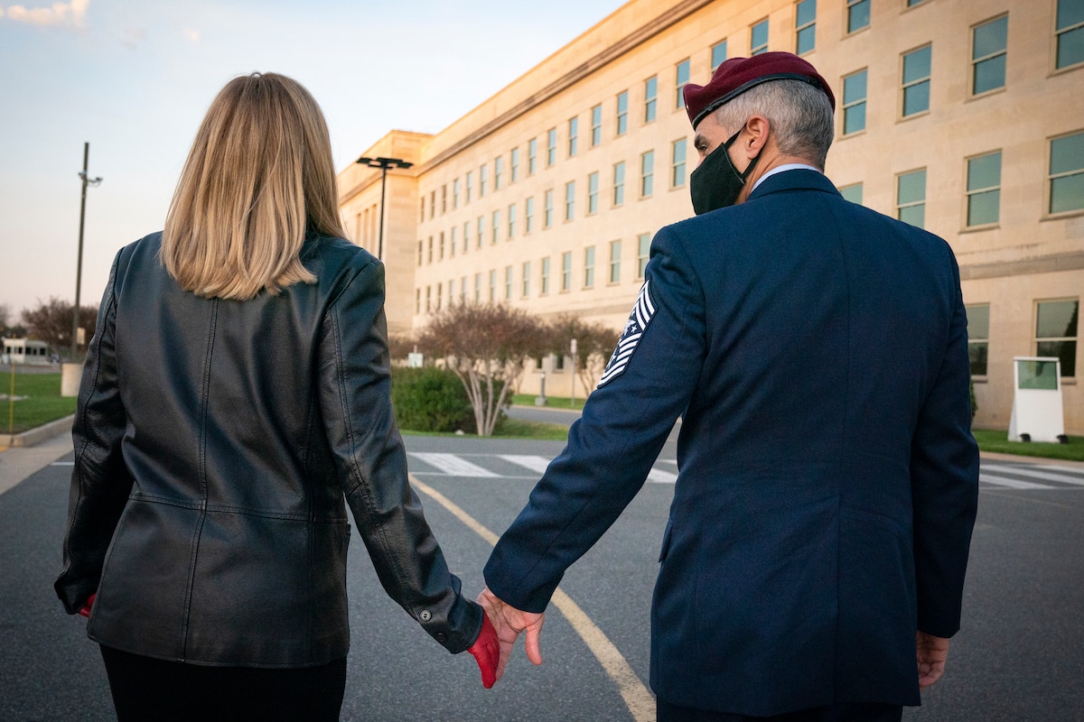 Senior Enlisted Advisor to the Chairman of the Joint Chiefs of Staff Ramón "CZ" Colón-López walks with his wife, Janet Colón, after his reenlistment ceremony held at the National 9/11 Pentagon Memorial, Arlington, Va., Nov. 19, 2020. (Department of Defense photo by Navy Petty Officer 1st Class Carlos M. Vazquez II)