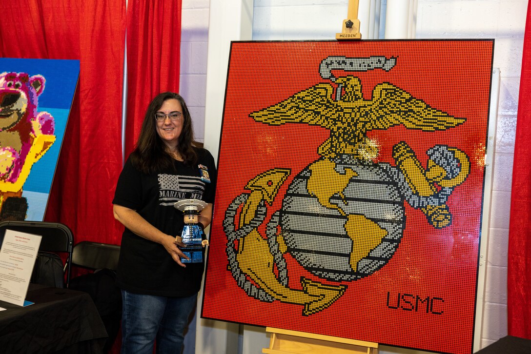 Lego exhibits sit on display during BrickFair at the Dulles Expo Center in Chantilly, Virginia, Aug. 4, 2023. Sherry Harris created her first original Lego creation for exhibition in 2022, creating a Marine with the likeness of her son, U.S. Marine Corps Sgt. Hunter S. Upson, an intelligence specialist with 2nd Marine Division. This year, she created a 28,160-piece Lego mosaic Eagle, Globe, and Anchor.(U.S. Marine Corps Photo by Lance Cpl. Kayla LeClaire)