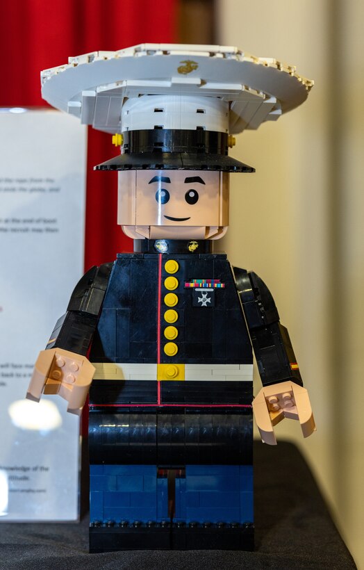 Lego exhibits sit on display during BrickFair at the Dulles Expo Center in Chantilly, Virginia, Aug. 4, 2023. Sherry Harris created her first original Lego creation for exhibition in 2022, creating a Marine with the likeness of her son, U.S. Marine Corps Sgt. Hunter S. Upson, an intelligence specialist with 2nd Marine Division. This year, she created a 28,160-piece Lego mosaic Eagle, Globe, and Anchor.(U.S. Marine Corps Photo by Lance Cpl. Kayla LeClaire)