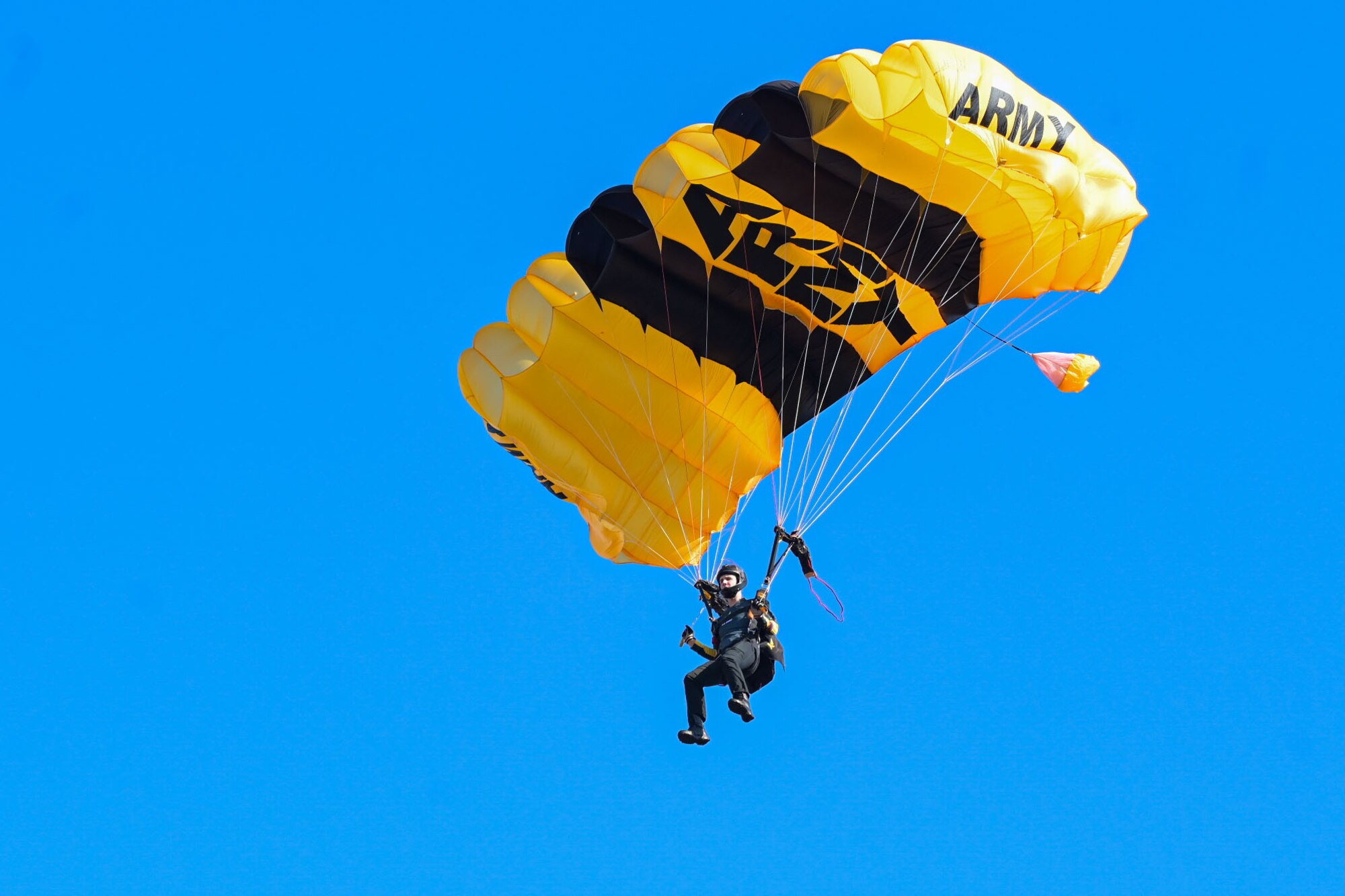 Golden knight parachuting in the air