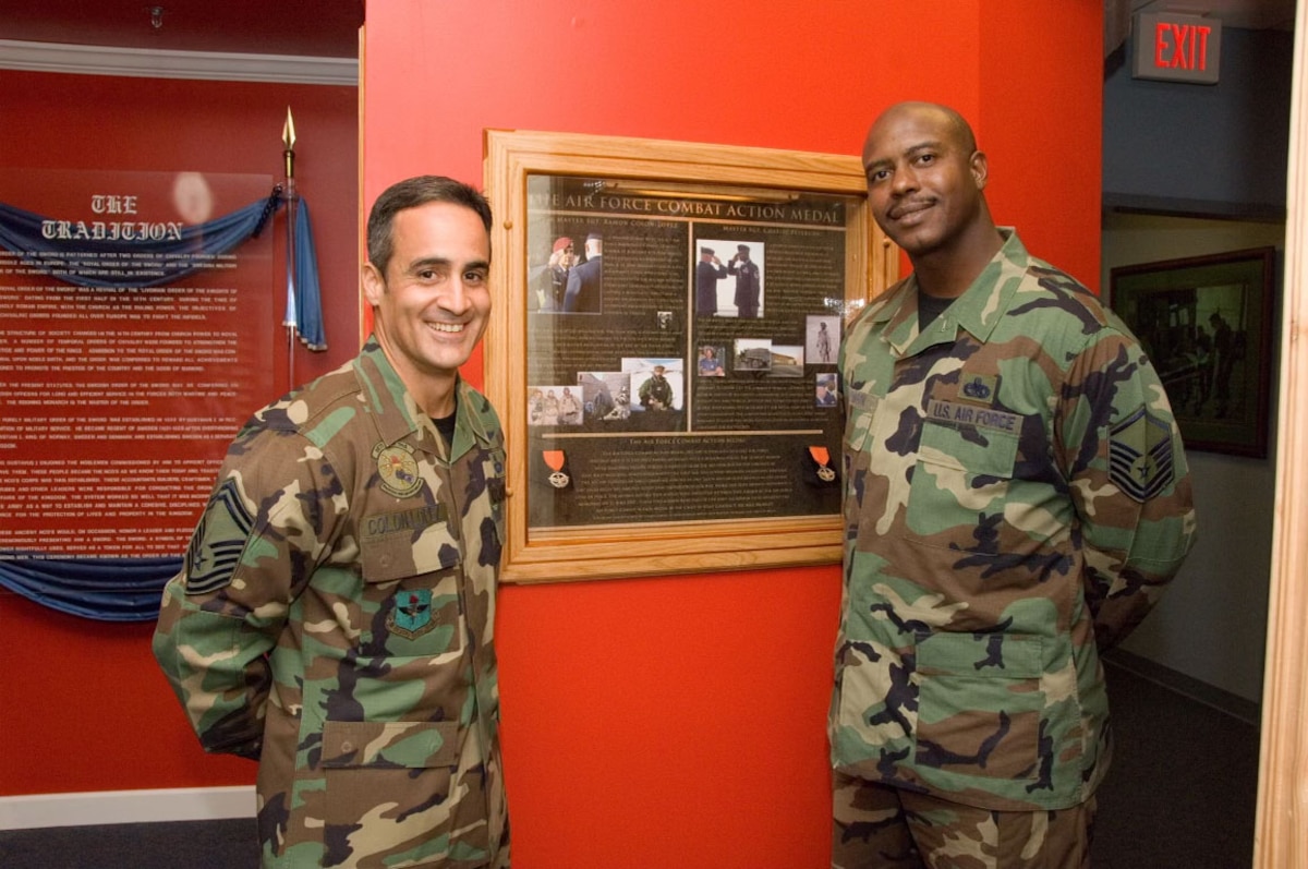 Senior Master Sgt. Ramón "CZ" Colón-López and MSgt Charlie Peterson donate their Air Force Combat Action Medals to the Enlisted Heritage Research Institute in Montgomery, Ala., 2007. (Courtesy photo)
