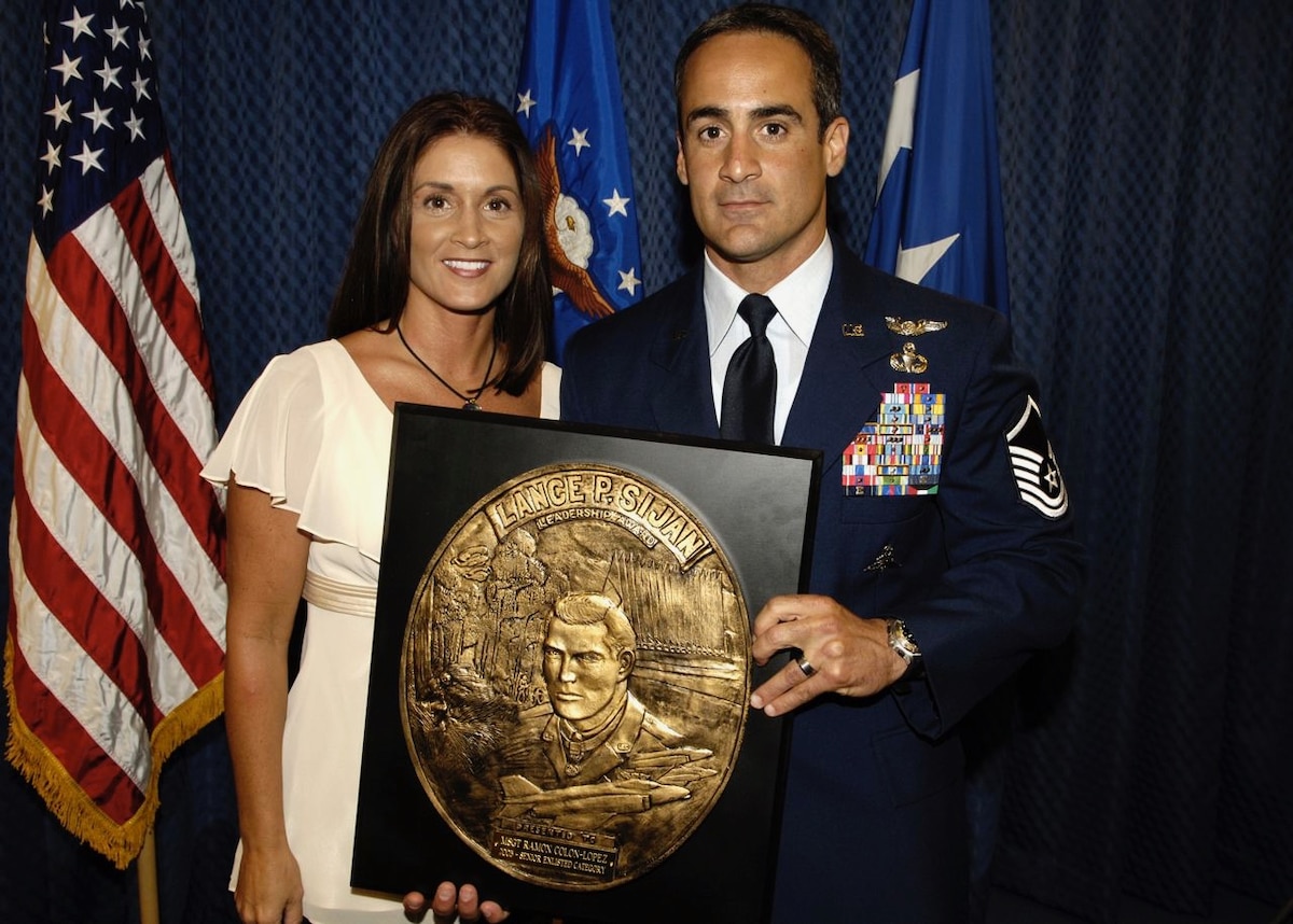 Master Sgt. Ramón "CZ" Colón-López poses for a photo with his wife Janet Colón, after receiving the 2005 Air Force Senior Noncommissioned Officer Lance P. Sijan Leadership Award. (Courtesy photo)
