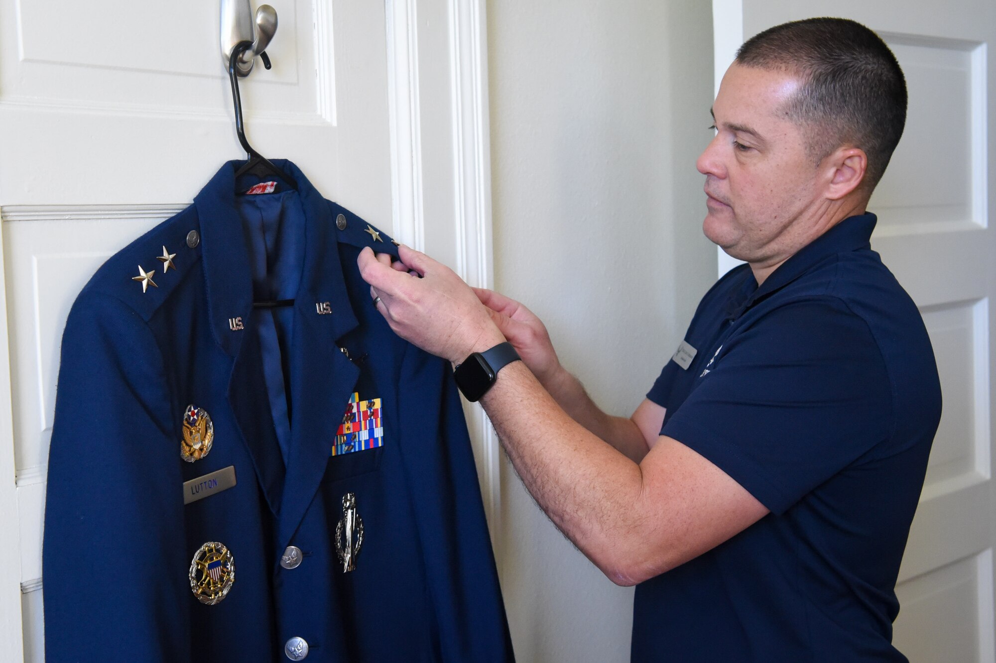 Enlisted aide prepares uniform