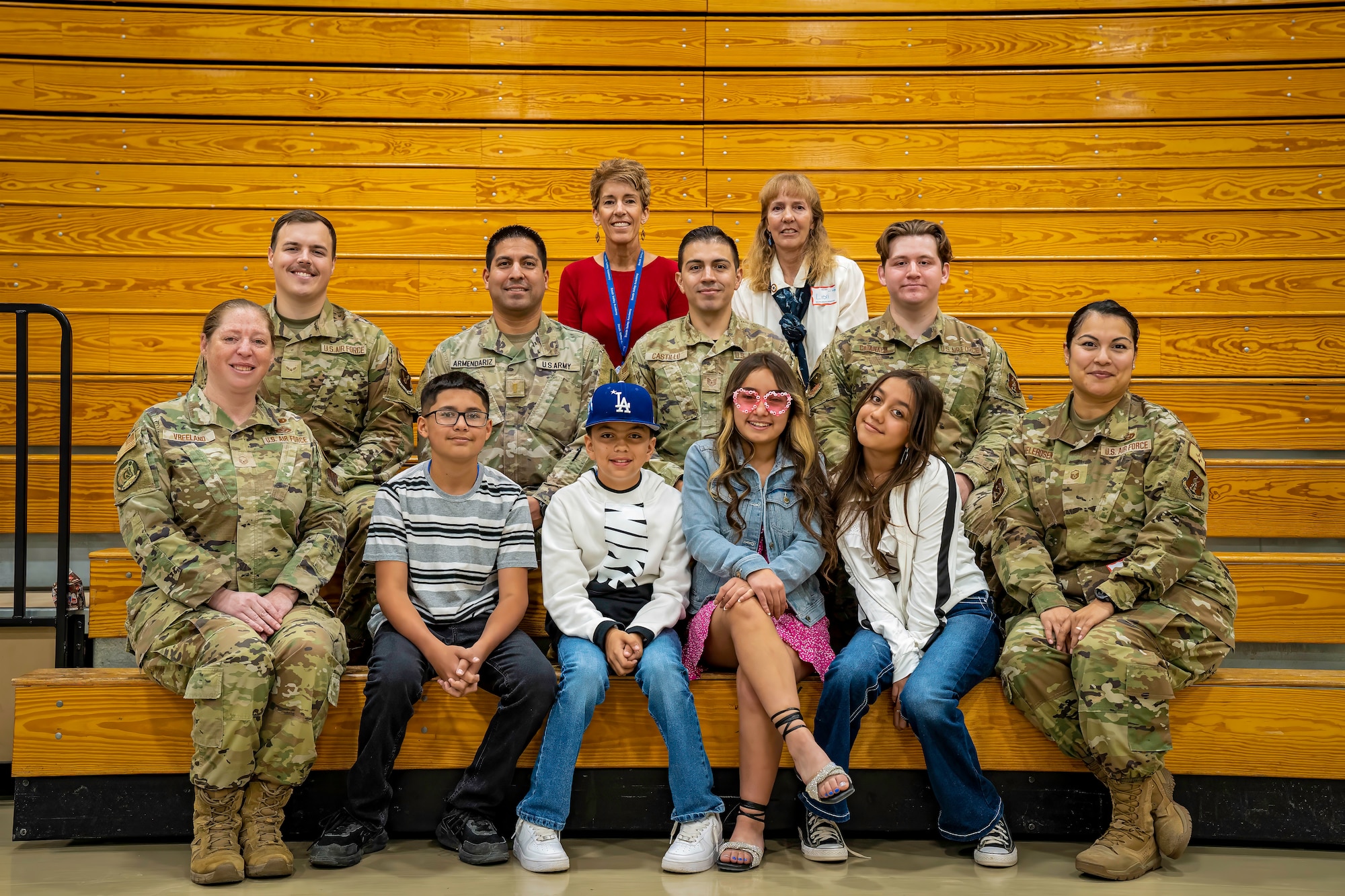 Military members, South Valley Academy students and staff, and a Blue Star Mothers representative pose for a group photo.