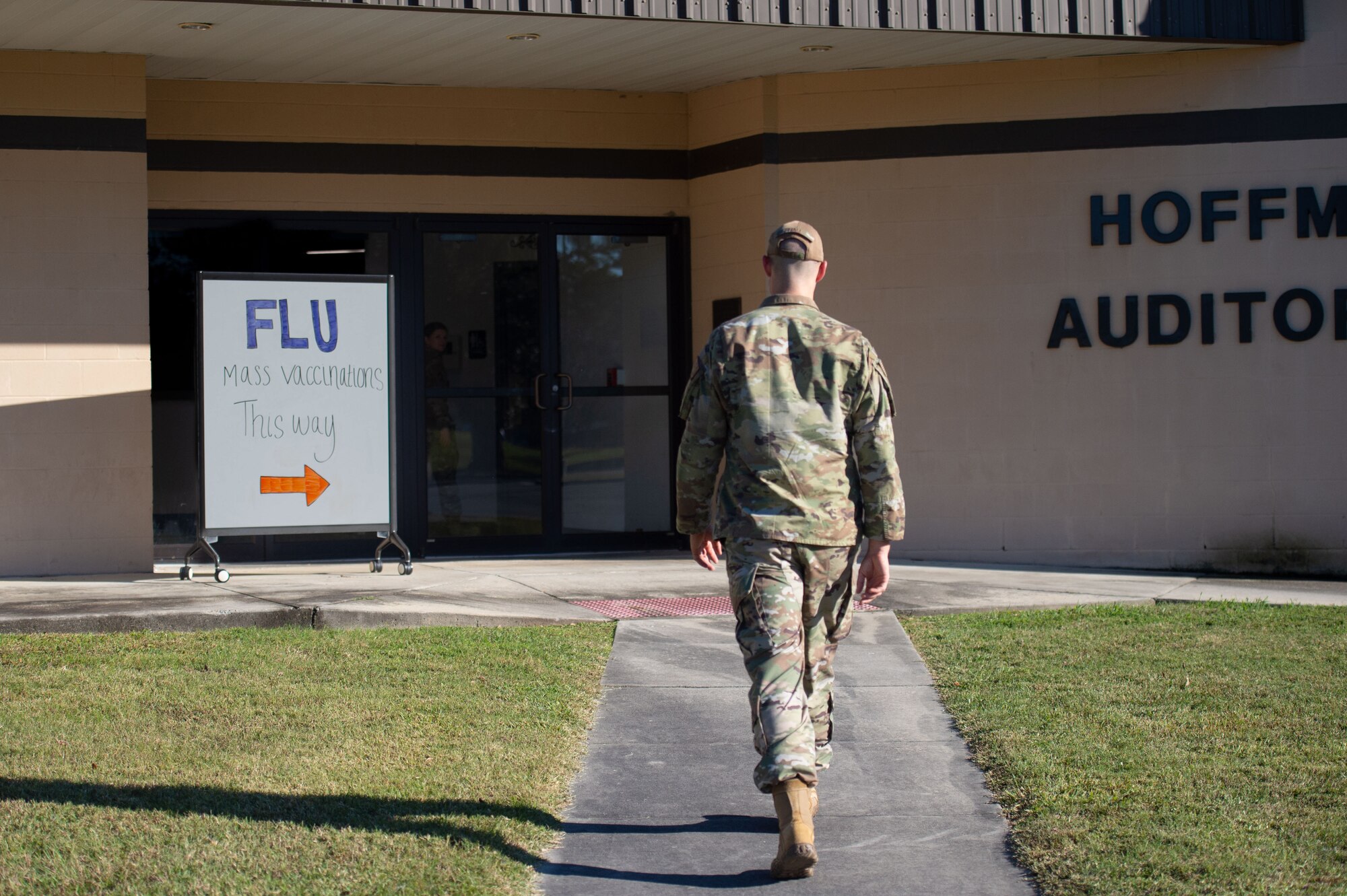 A U.S Air Force service member walks into the mass vaccination event at Moody Air Force Base, Georgia, Oct. 18, 2023. The 23rd Medical Group held their annual mass vaccination event, accomplishing a 60% vaccination completion status in just two days. (U.S Air Force photo by Airman Cade Ellis)