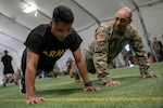 Colorado National Guard State Command Sergeant Major U.S. Army Command Sgt. Maj. John Assaad encourages a Best Warrior competitor during the physical fitness event of the 2022 Colorado Best Warrior Competition, Fort Carson, Colorado, April 21, 2022. BWC competitors test their physical and mental prowess during a series of events while striving to be crowned the best. (U.S. Army National Guard photo by Sgt. Taylor Lakey-Tamacori)