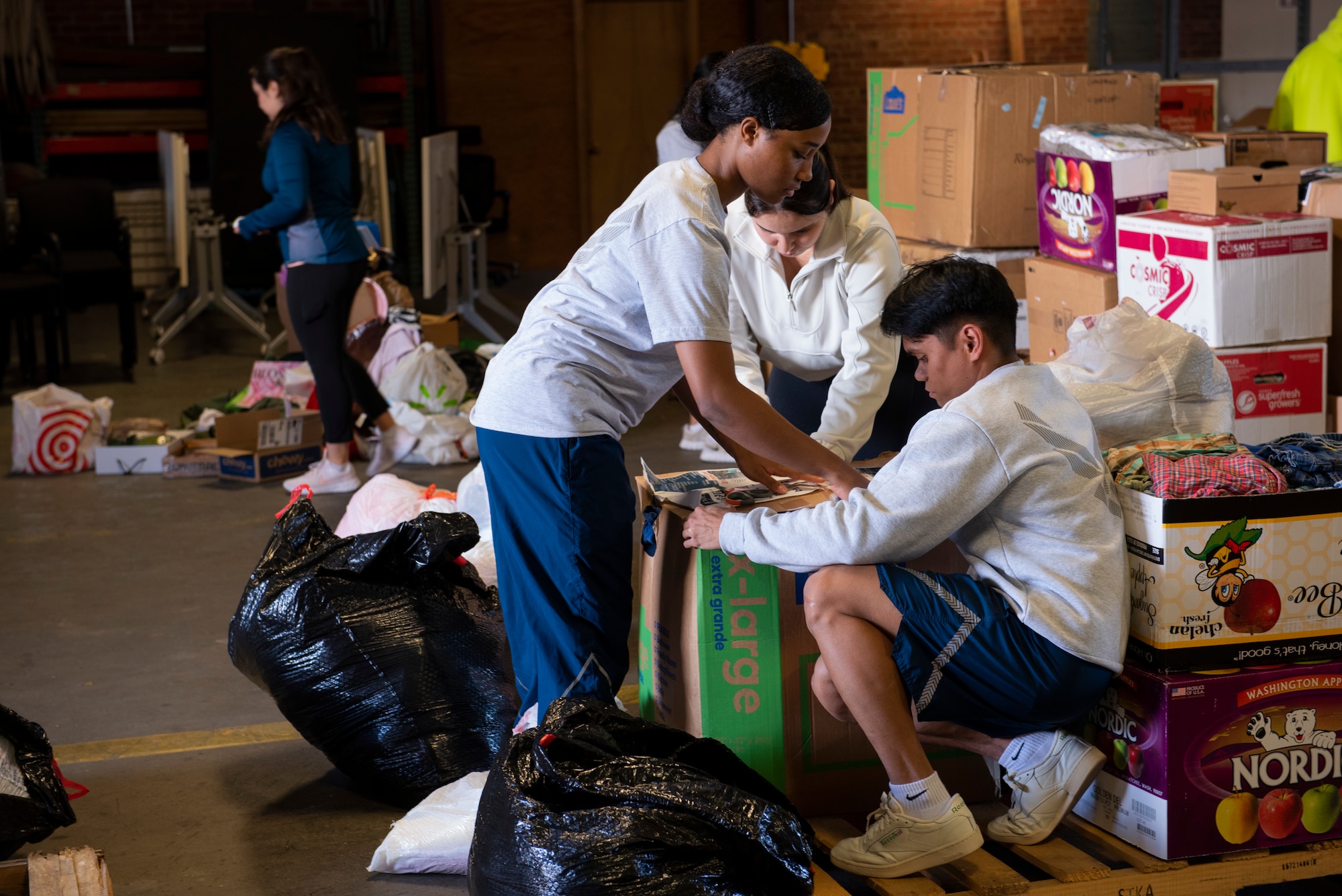 Team McChord Airmen organize donations for the Maui fire relief efforts at Joint Base Lewis-McChord, Wash., Oct. 19, 2023. A Seattle food bank picked up the donations and will transport them to Hawaii to provide aid to the Maui community. Team McChord holds volunteer opportunities to develop ready Airmen.
