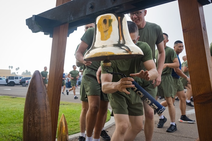New U.S. Marines with India Company 3rd Recruit Training Battalion, ring the liberty bell during the motivational run at Marine Corps Recruit Depot, San Diego, Oct. 19, 2023. The motivational run is the last physical training Marines conducted while at MCRD. (U.S. Marine Corps photo by Lance Cpl. Jacob B. Hutchinson)