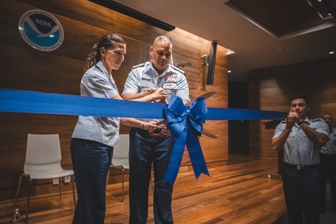 Rear Adm. Jo-Ann Burdian and Vice Adm. Andrew Tiongson cut ribbon for the new marine environmental response unit. Coast Guard stands up new marine environmental response unit in Honolulu.