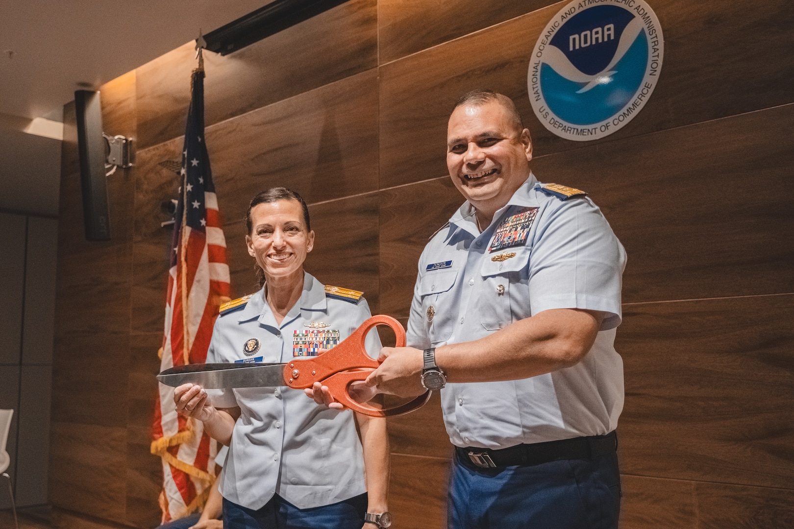 Rear Adm. Jo-Ann Burdian and Vice Adm. Andrew Tiongson pose for a photo. Coast Guard stands up new marine environmental response unit in Honolulu.