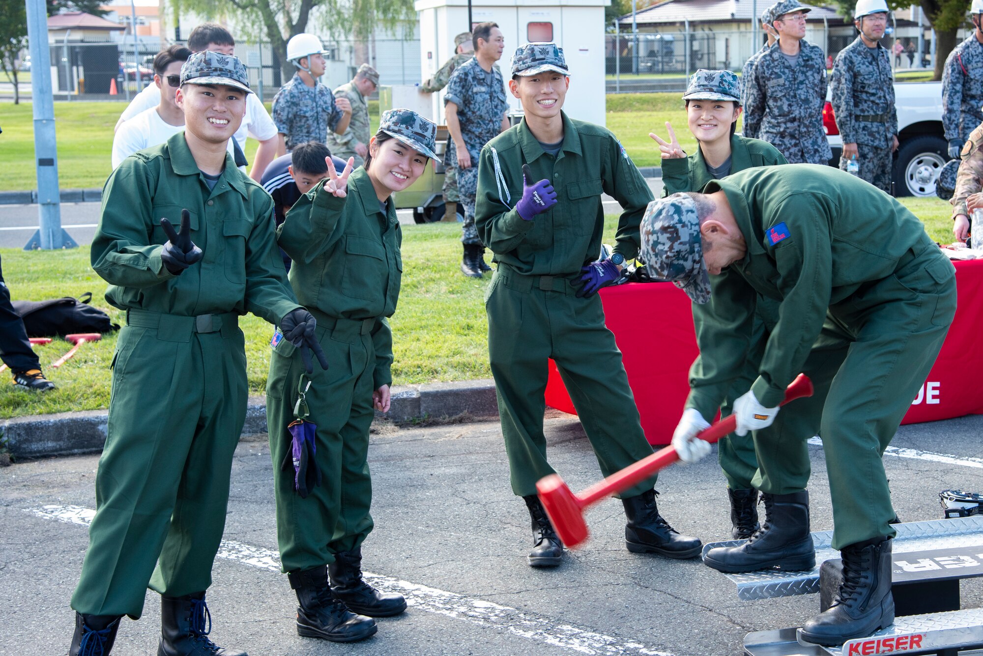 Japanese Air Self-Defense Force Fire Rescue Team pose for a group photo during Misawa Fire Muster at Misawa Air Base, Japan, Oct.12, 2023.