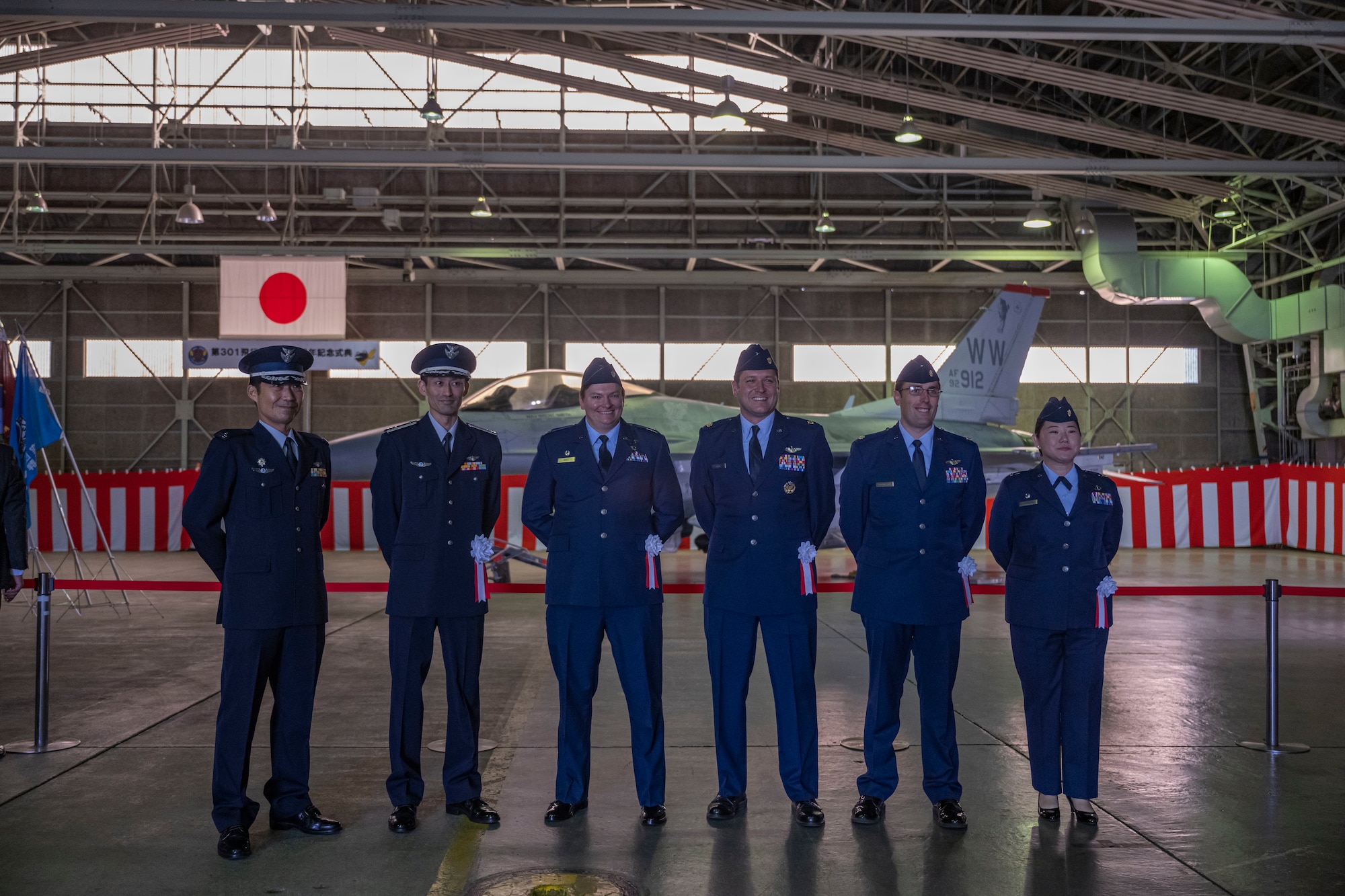 U.S. Air Force and Japan Air Self-Defense Force members pose for a group photo during the 301st Tactical Fighter Squadron’s 50th anniversary ceremony at Misawa Air Base, Japan, Oct 14, 2023.