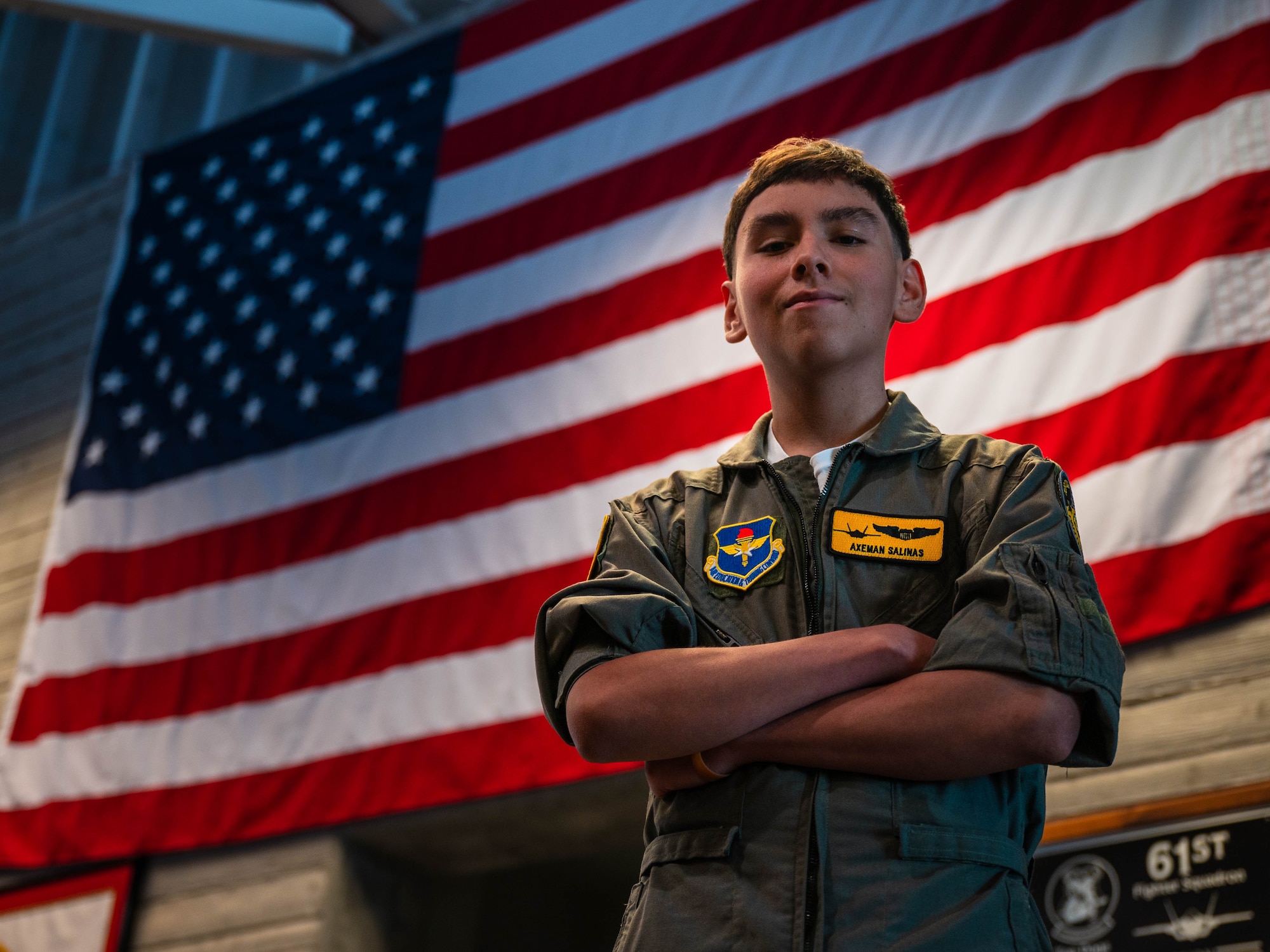 Isaac “Axe-man” Salinas, Luke Air Force Base pilot for a day, and his family receive a tour of Luke AFB