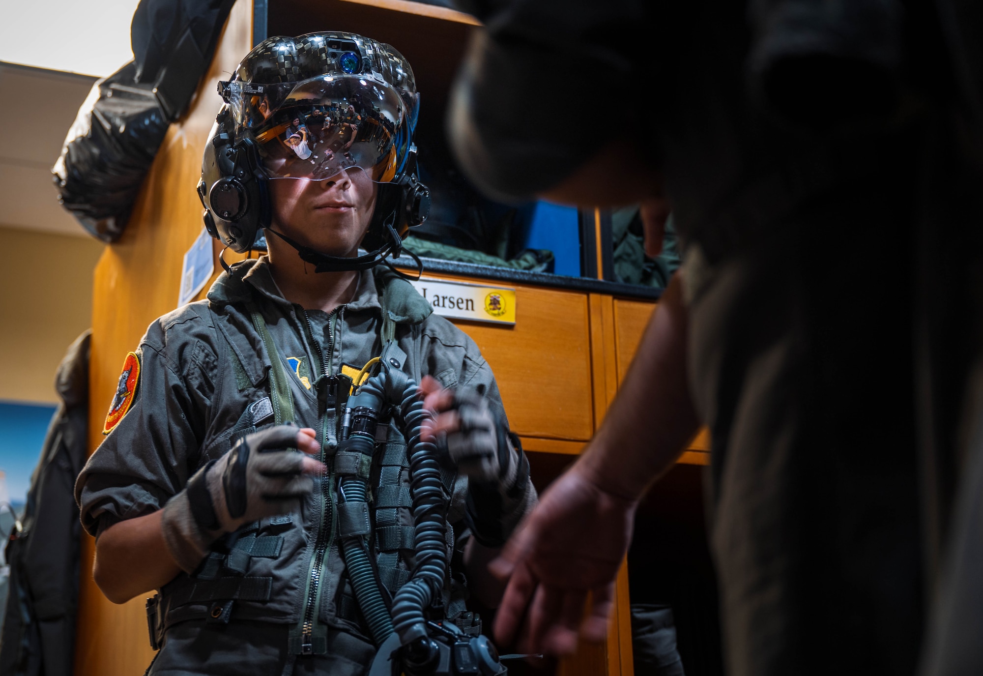 Isaac “Axe-man” Salinas, Luke Air Force Base pilot for a day, and his family receive a tour of Luke AFB