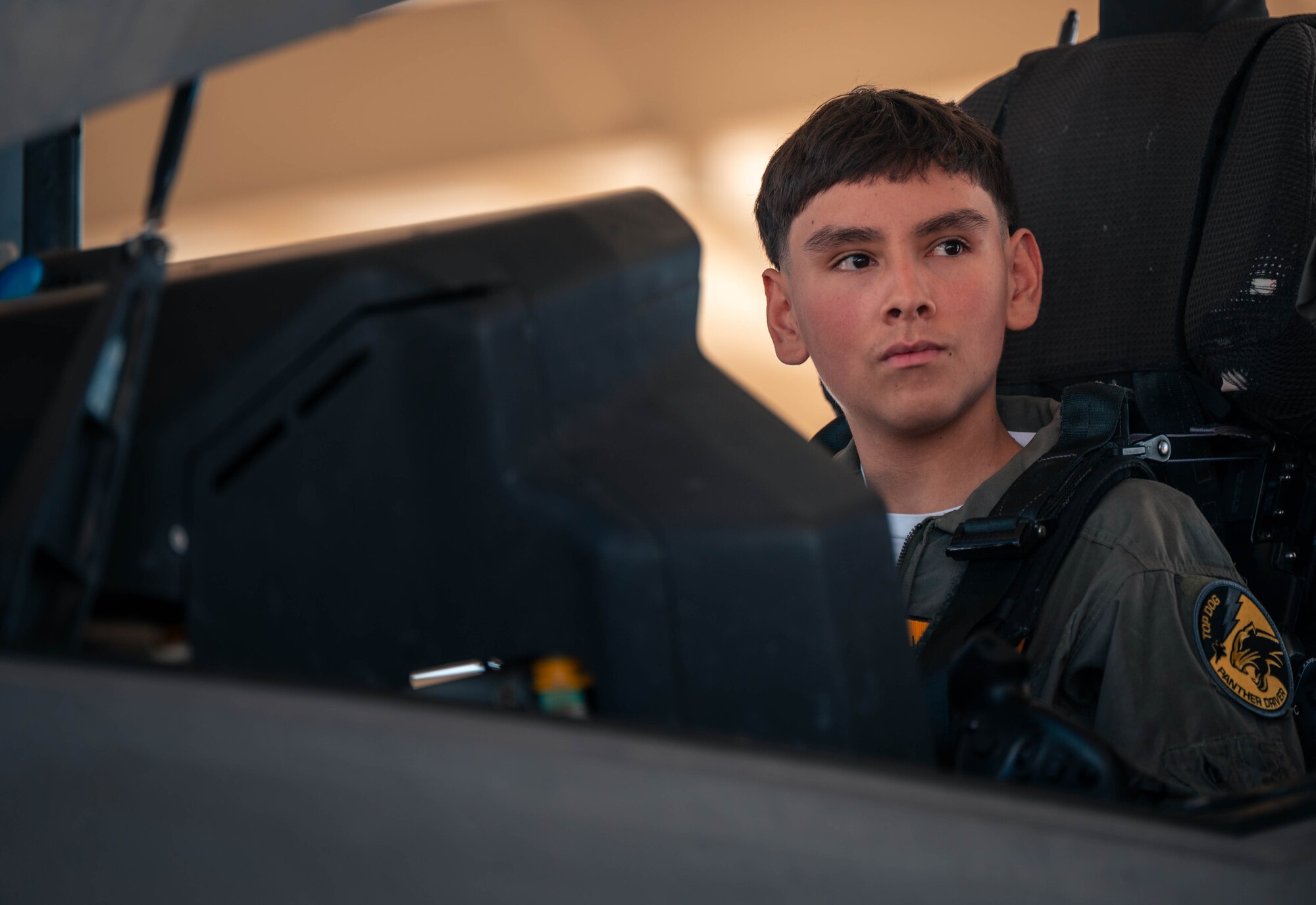 Isaac “Axe-man” Salinas, Luke Air Force Base pilot for a day, and his family receive a tour of Luke AFB