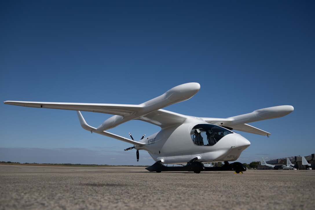 A BETA Technologies Alia conventional takeoff and landing aircraft sits on the flightline