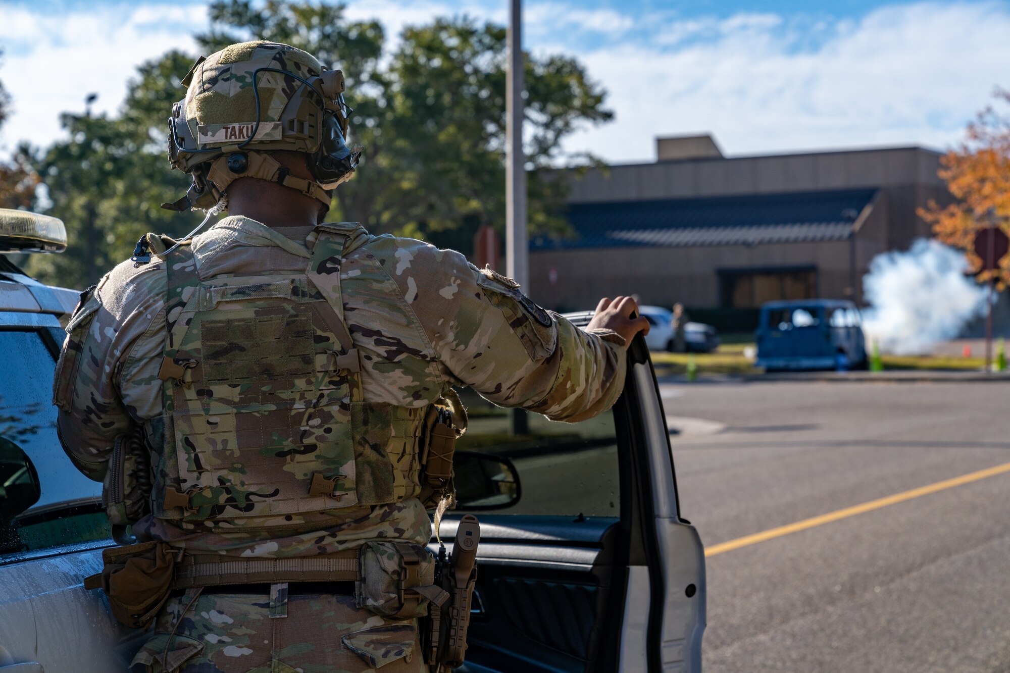 U.S. Air Force Tech. Sgt. Michael Taku, 81st Security Forces Squadron investigator, cordons off the area around a simulated vehicle explosion during a training exercise at Keesler Air Force Base, Mississippi, Oct. 19, 2023.