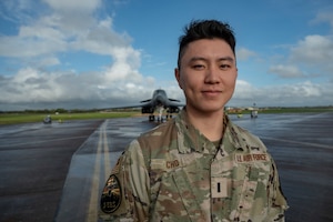 1st Lt. David Cho, 9th Expeditionary Bomb Squadron maintenance assistant officer in charge, poses for a photo at RAF Fairford, United Kingdom, Oct. 19, 2023. Cho, reminisced about his family, culture and past during his first Bomber Task Force mission. (U.S. Air Force Photo by Senior Airman Ryan Hayman)