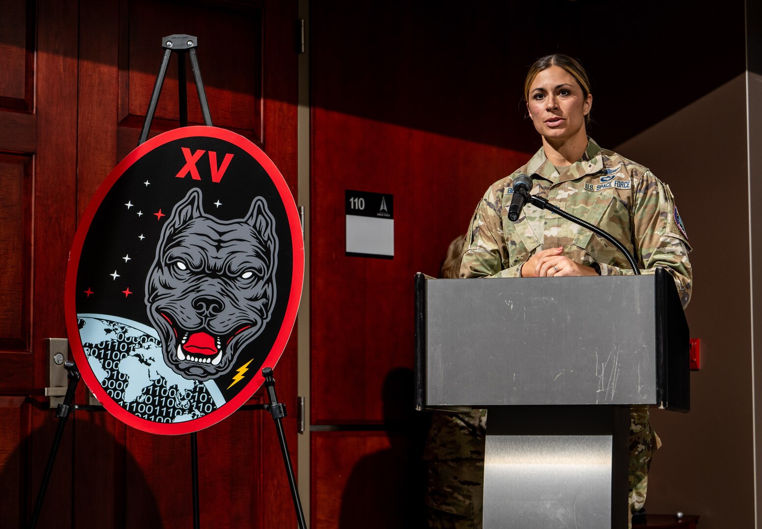 woman standing at podium speaking