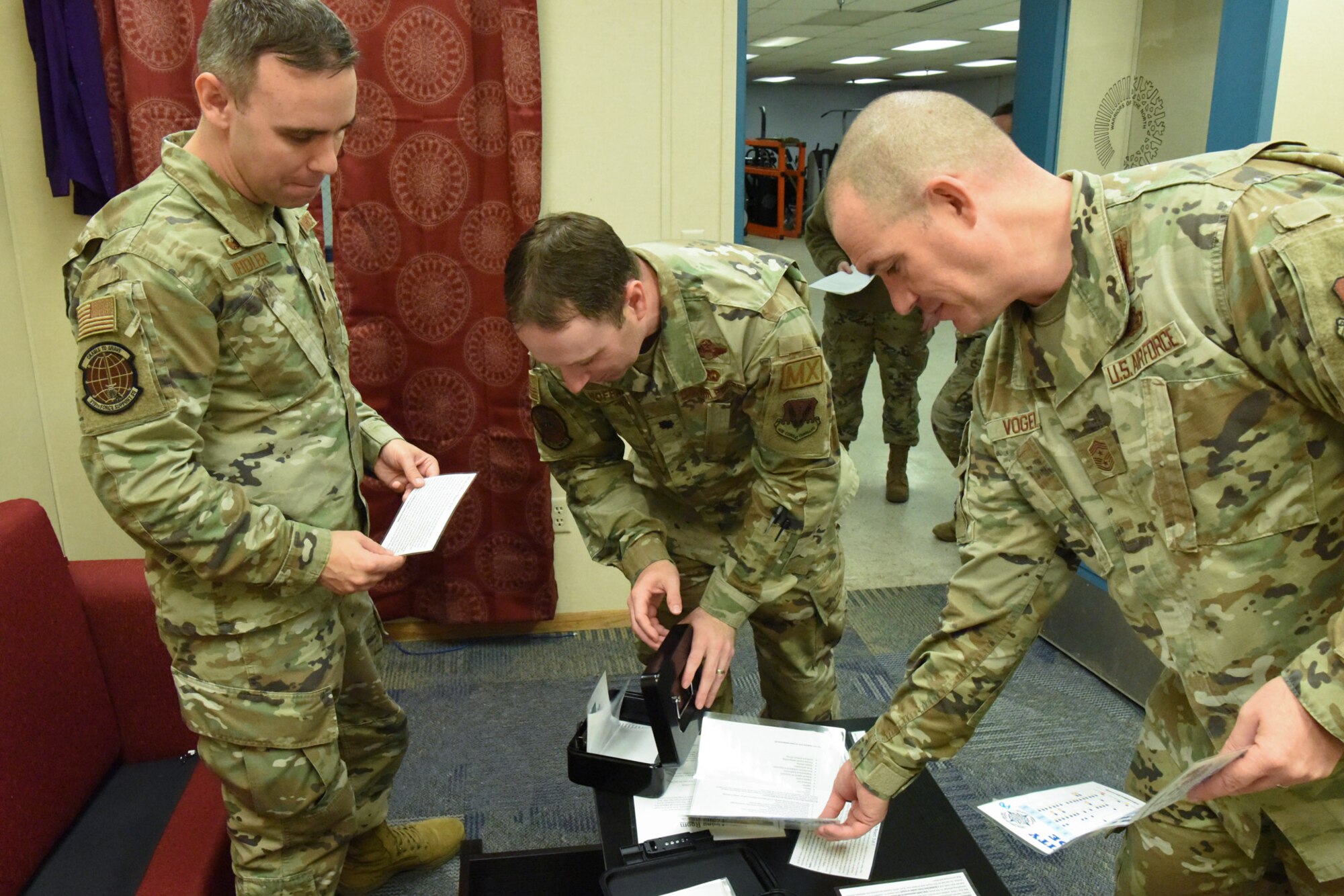 Airmen leaders discover clues in a discovery room.